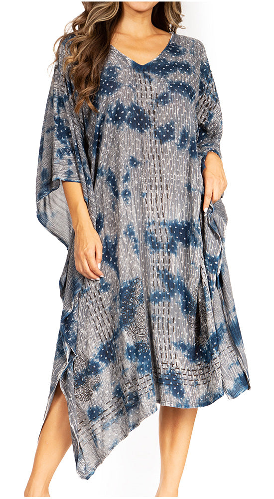 Woman wearing a blue and gray patterned dress on a white background