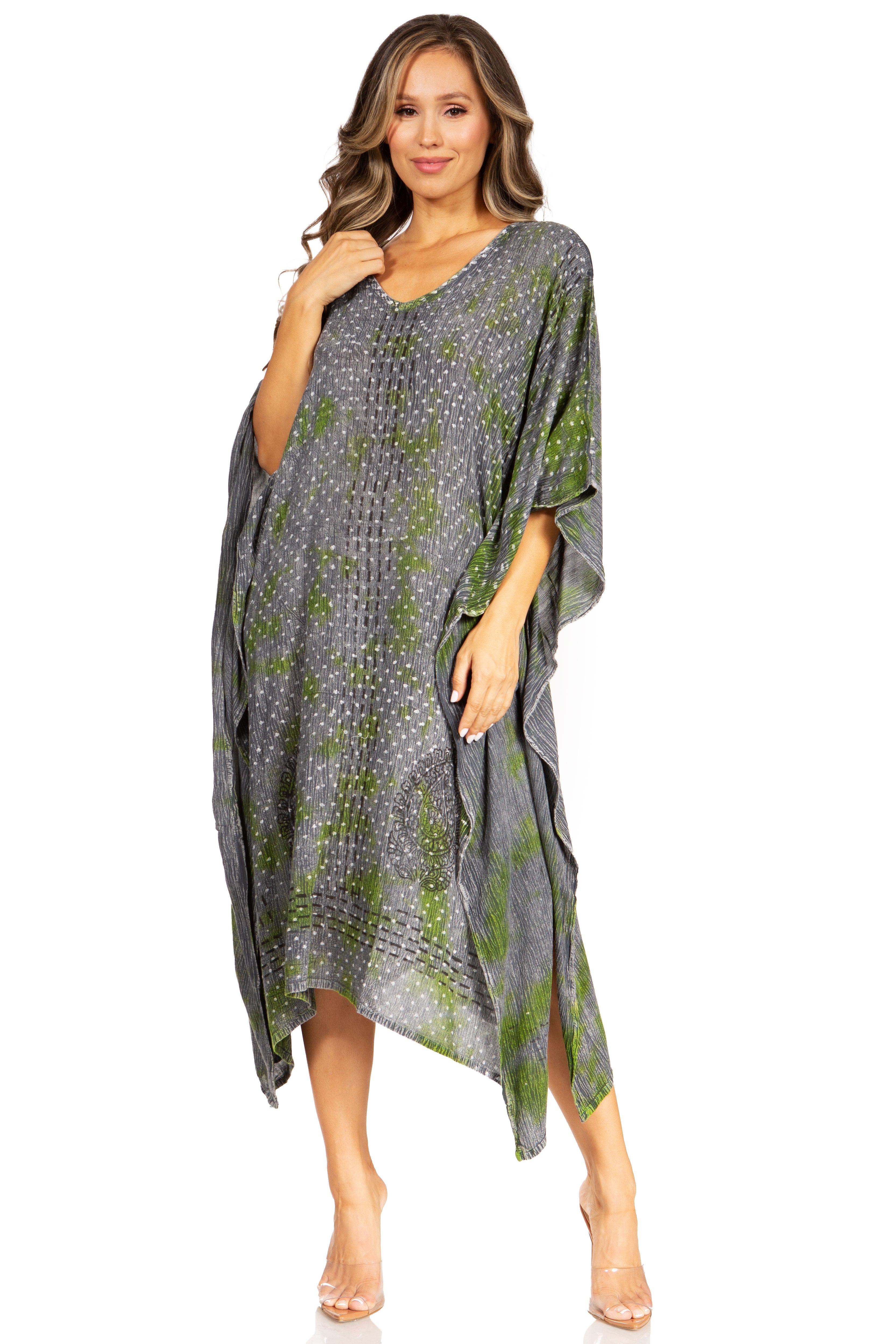 Woman wearing a gray and green patterned dress on a white background