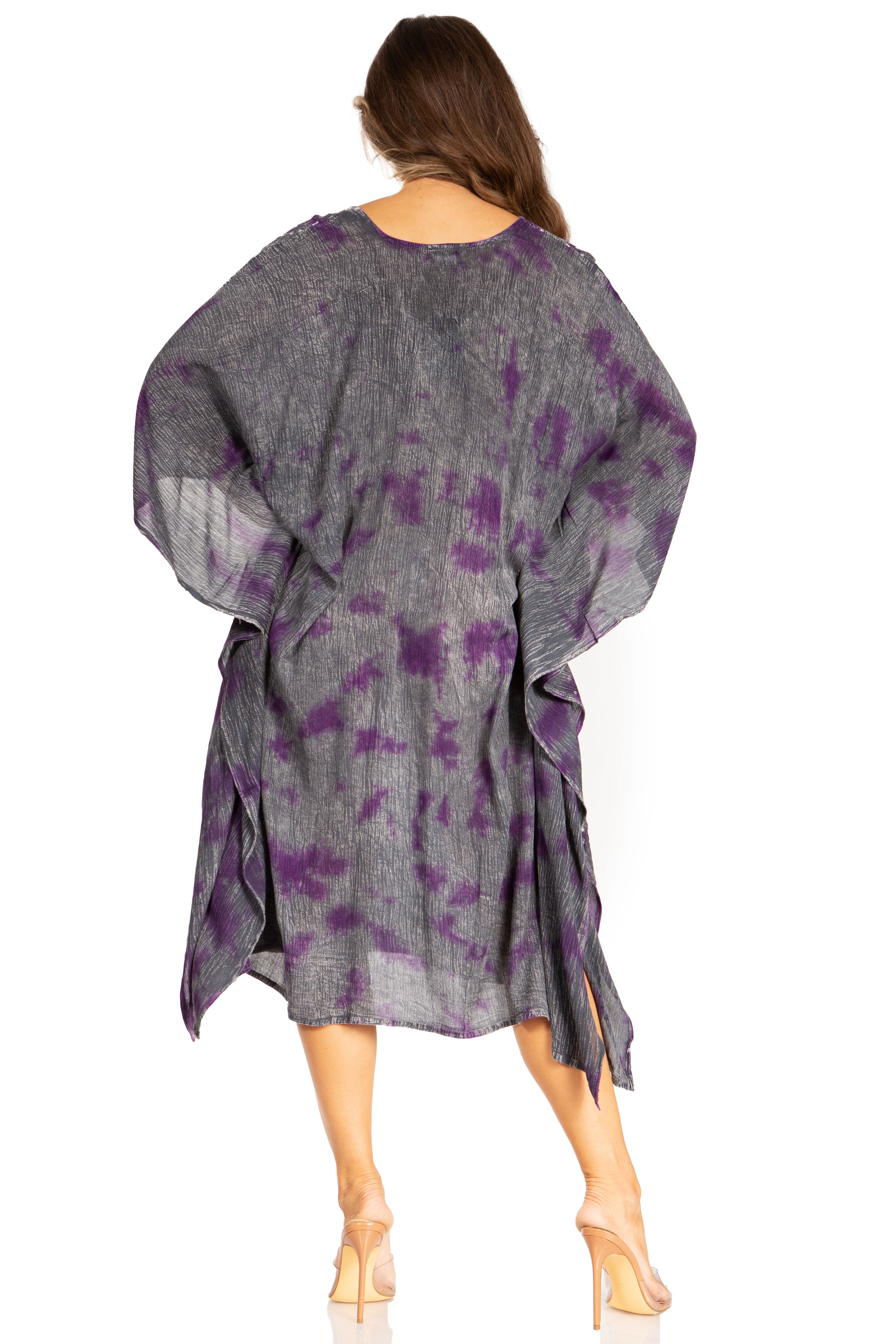 Woman wearing a gray and purple patterned dress on a white background