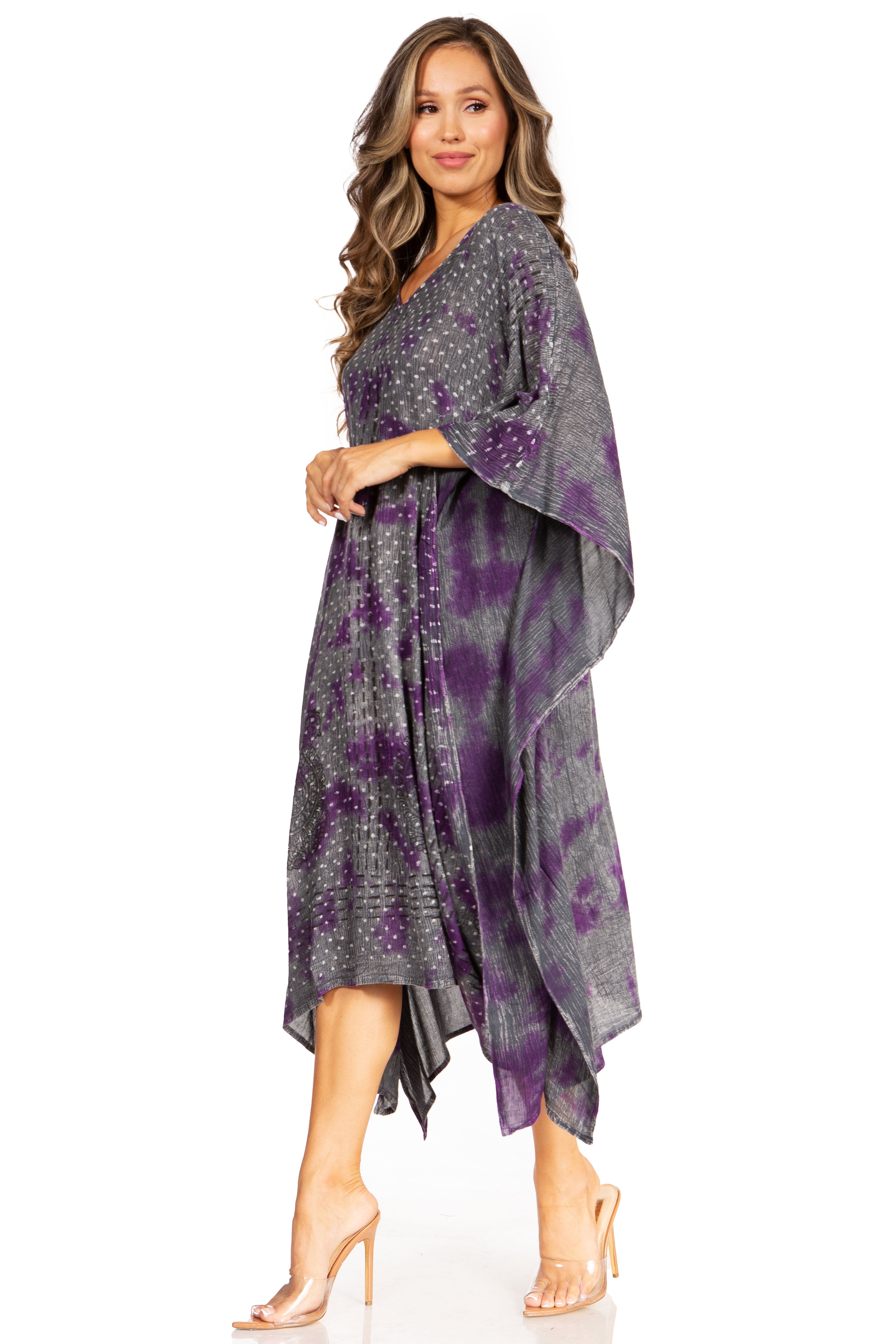 Woman wearing a purple and gray patterned dress on a white background