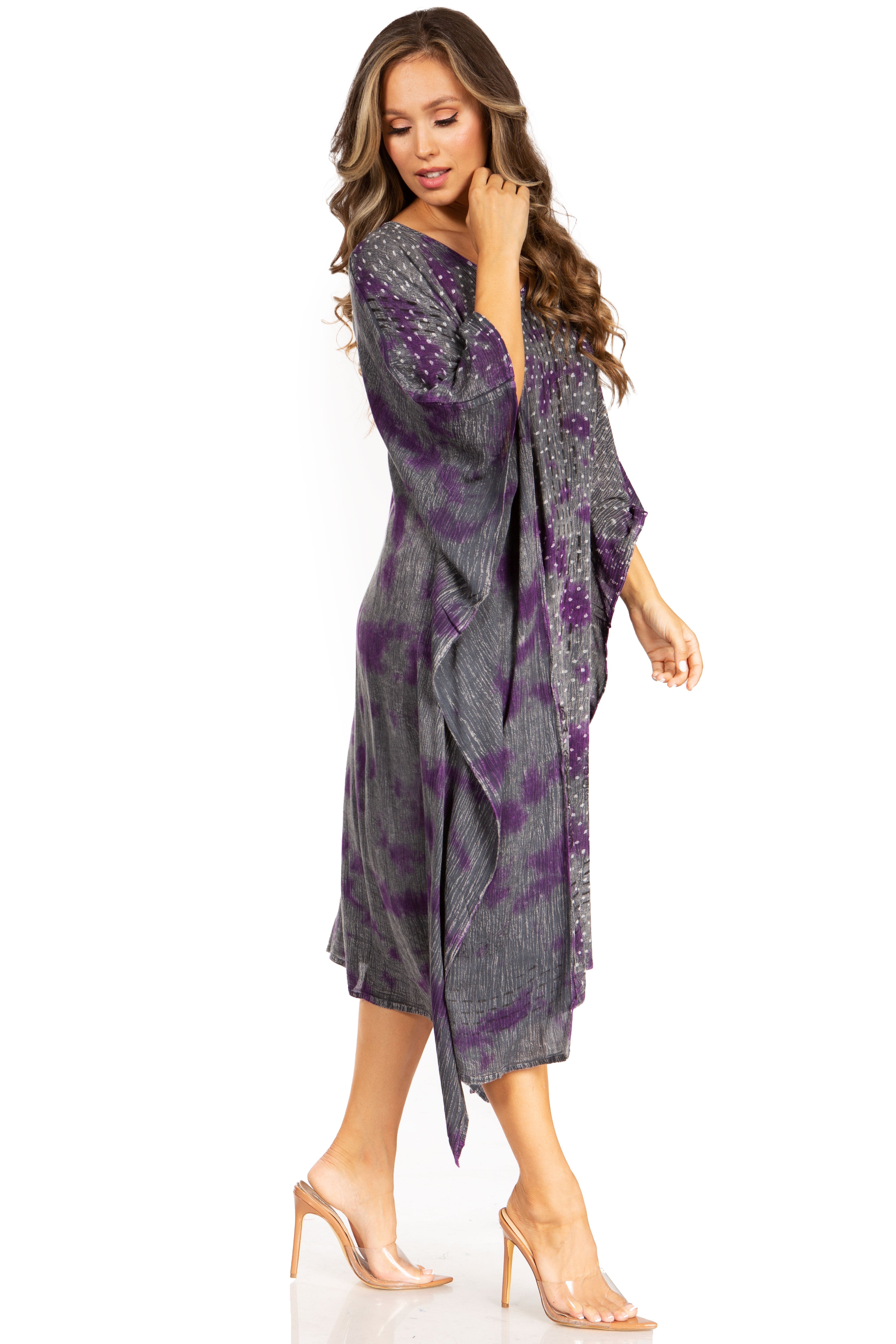 Woman wearing a gray and purple patterned dress on a white background