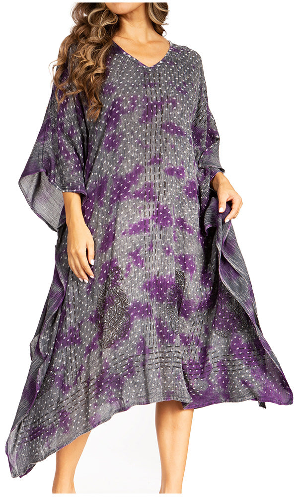 Woman wearing a gray and purple patterned dress on a white background