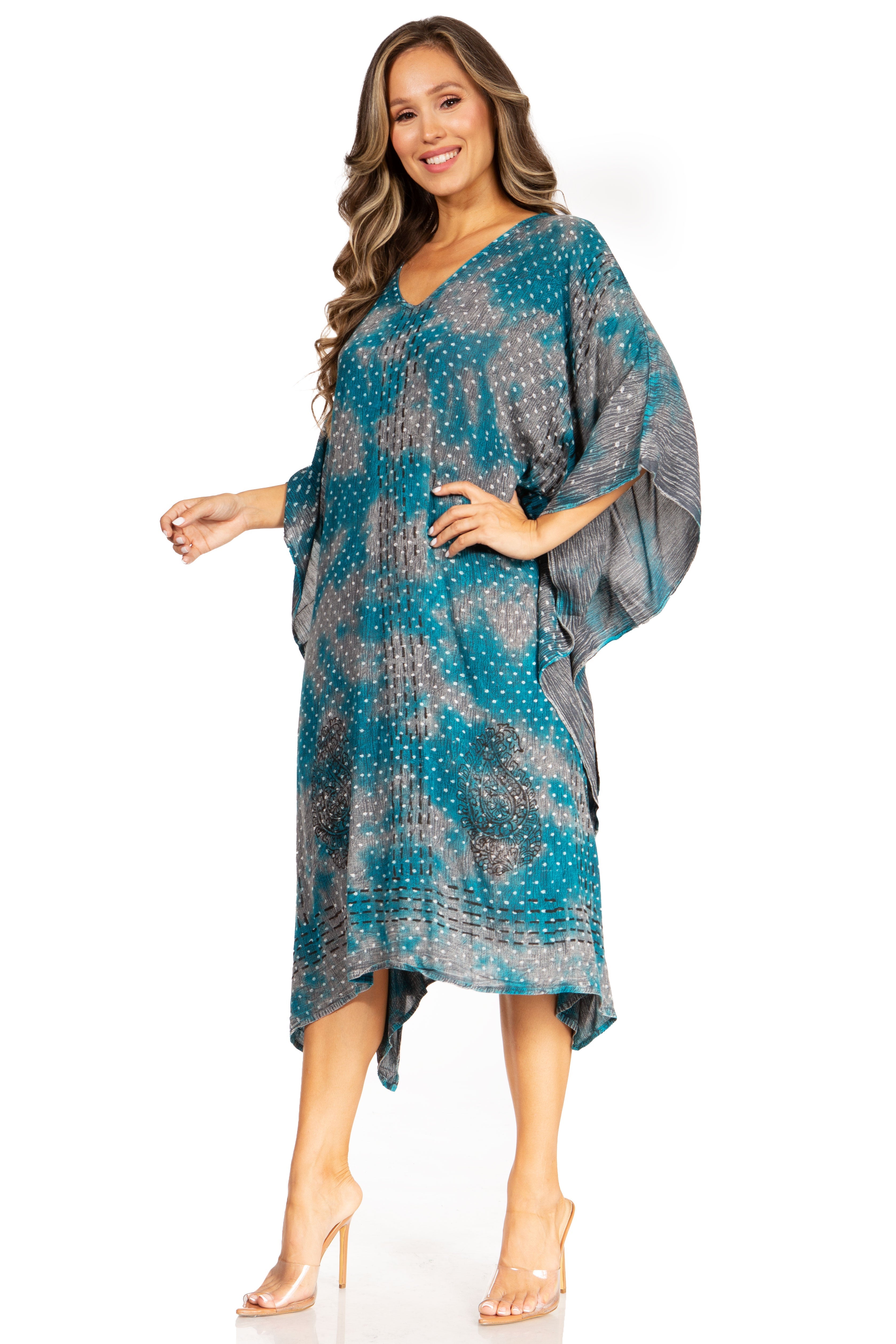 Woman wearing a blue and gray patterned dress on a white background