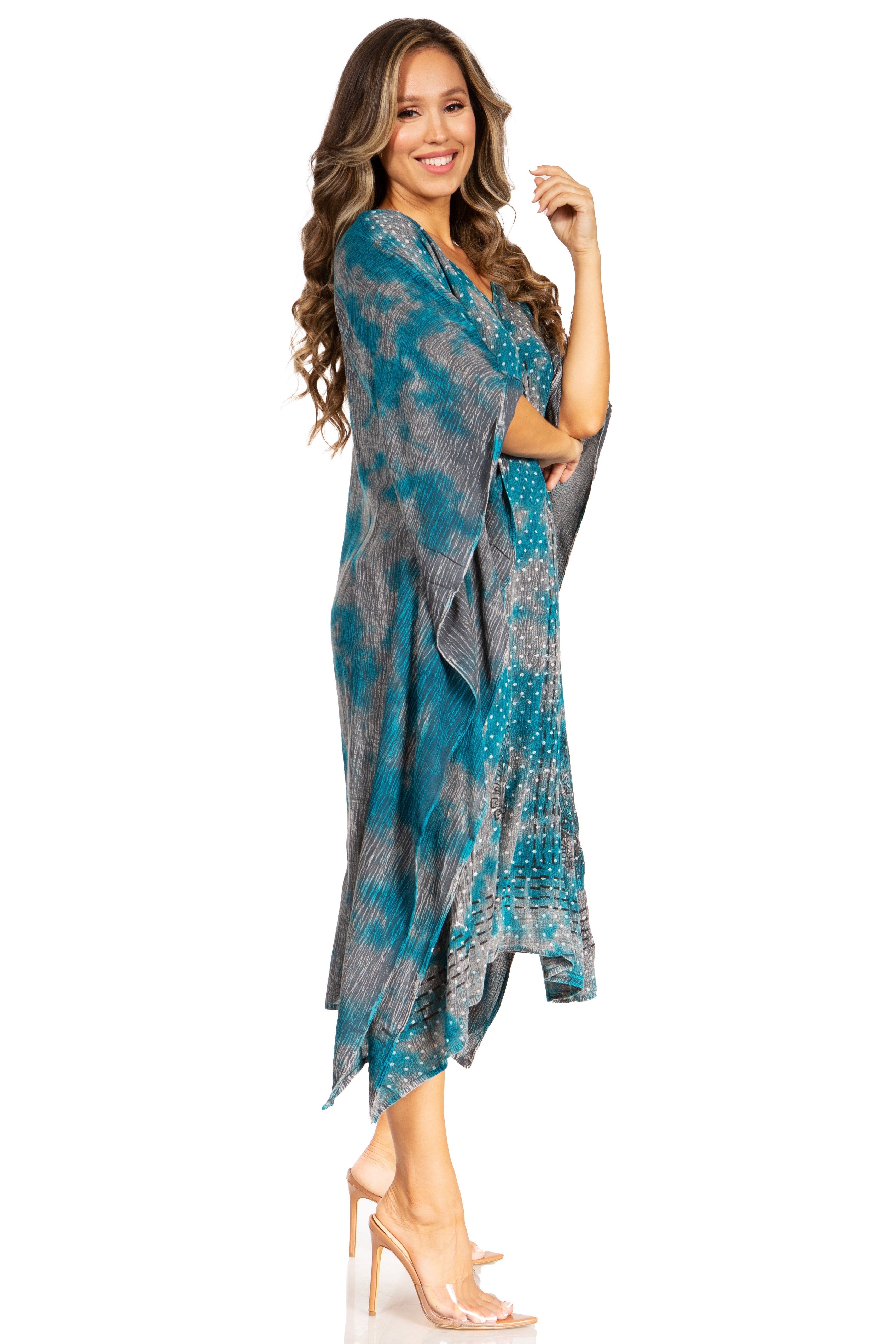Woman wearing a blue and gray patterned dress on a white background