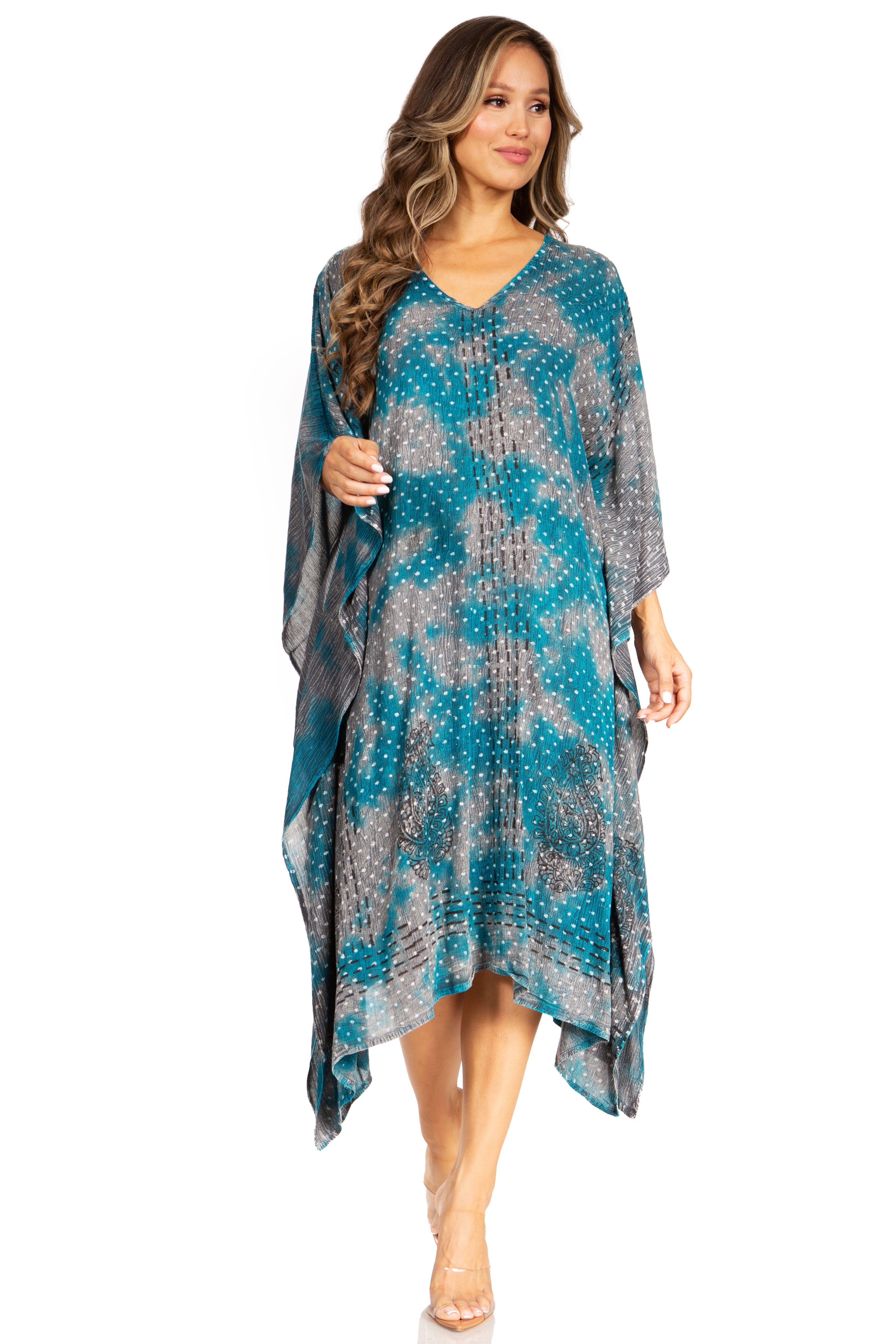 Woman wearing a blue and gray patterned dress on a white background