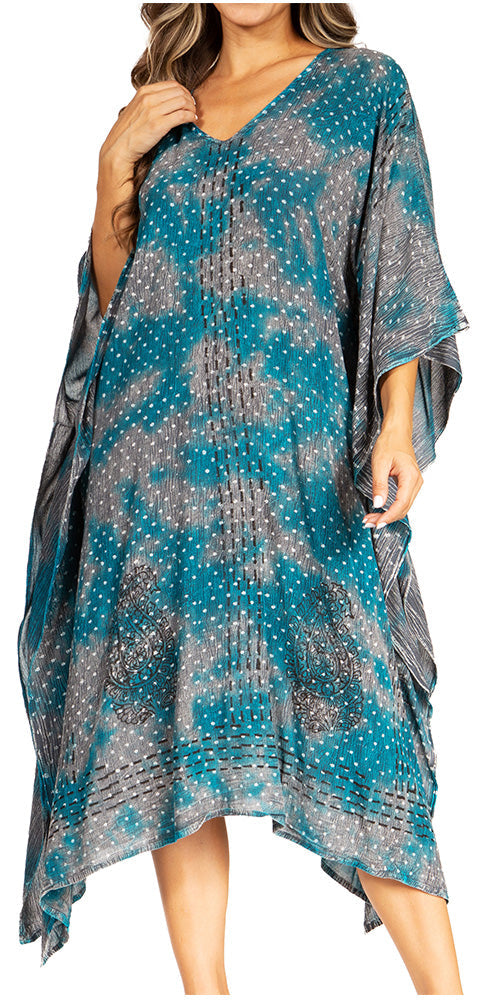 Woman wearing a blue and gray patterned dress on a white background
