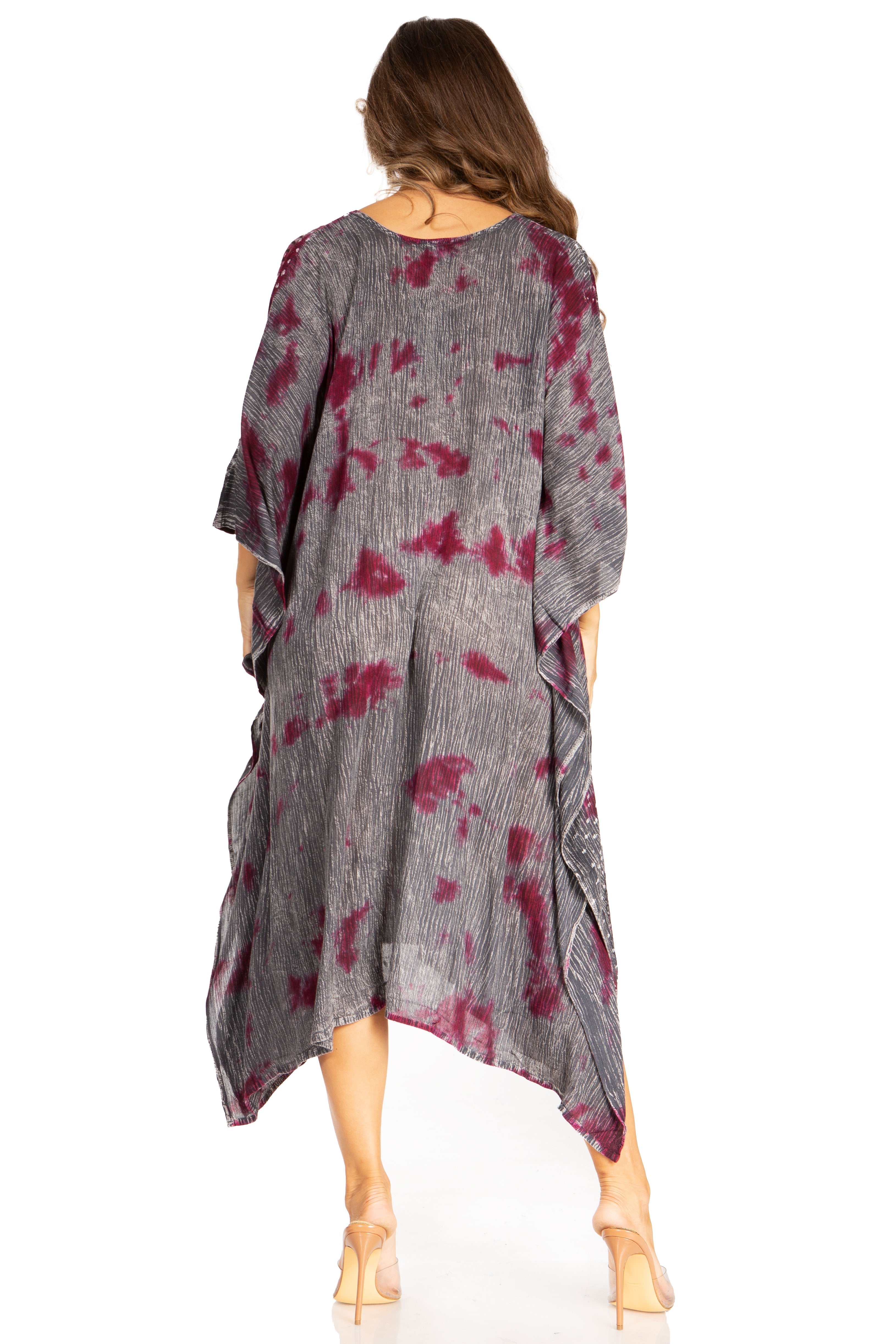 Woman wearing a gray and red tie-dye dress on a white background