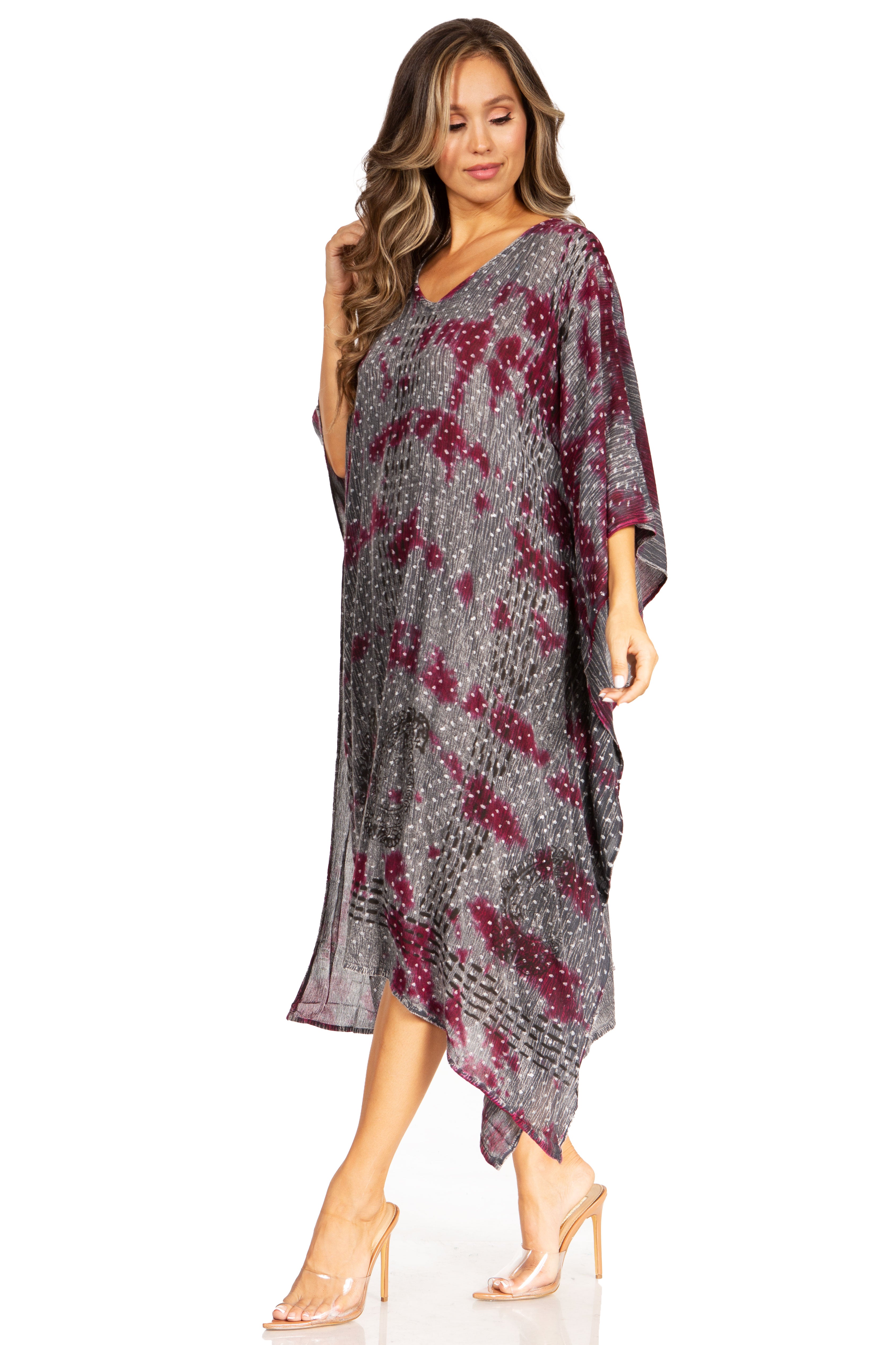 Woman wearing a patterned dress on a white background