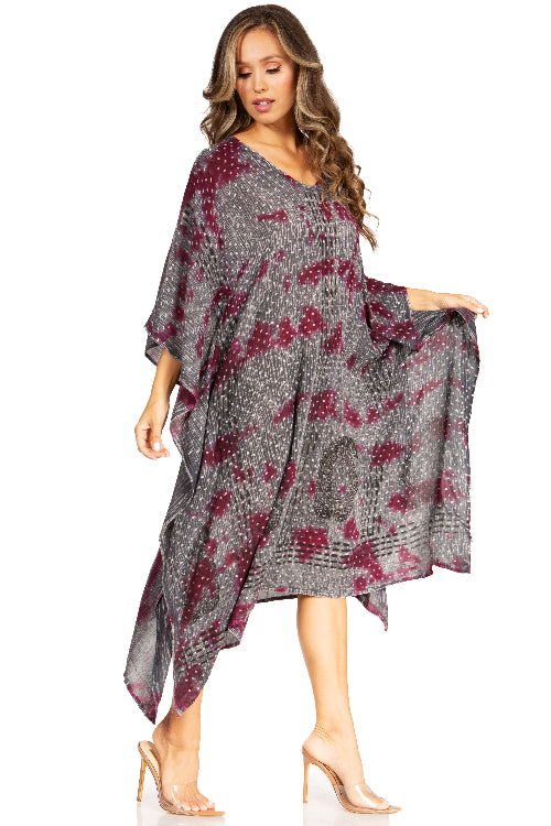 Woman wearing a patterned dress on a white background