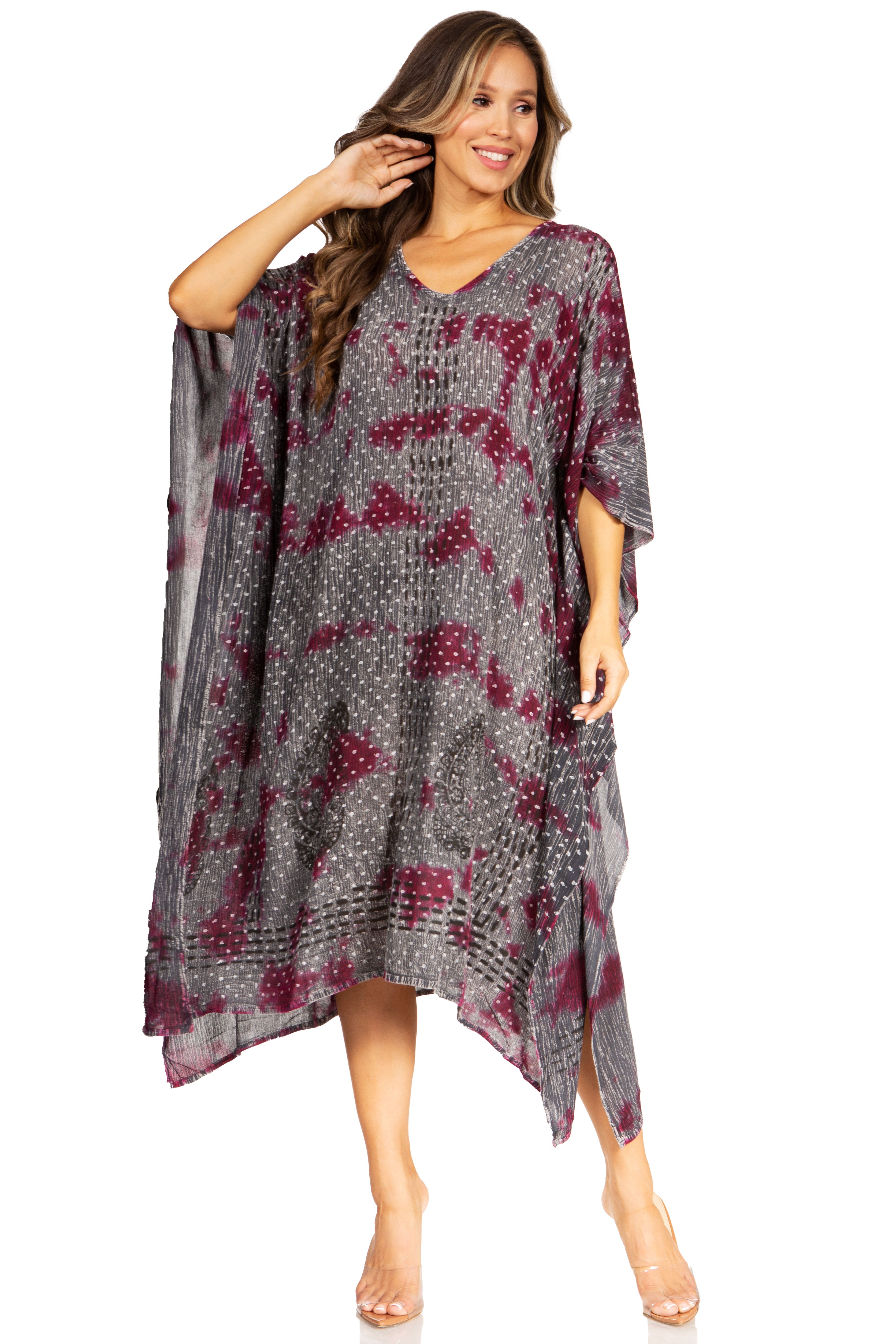 Woman wearing a patterned dress on a white background