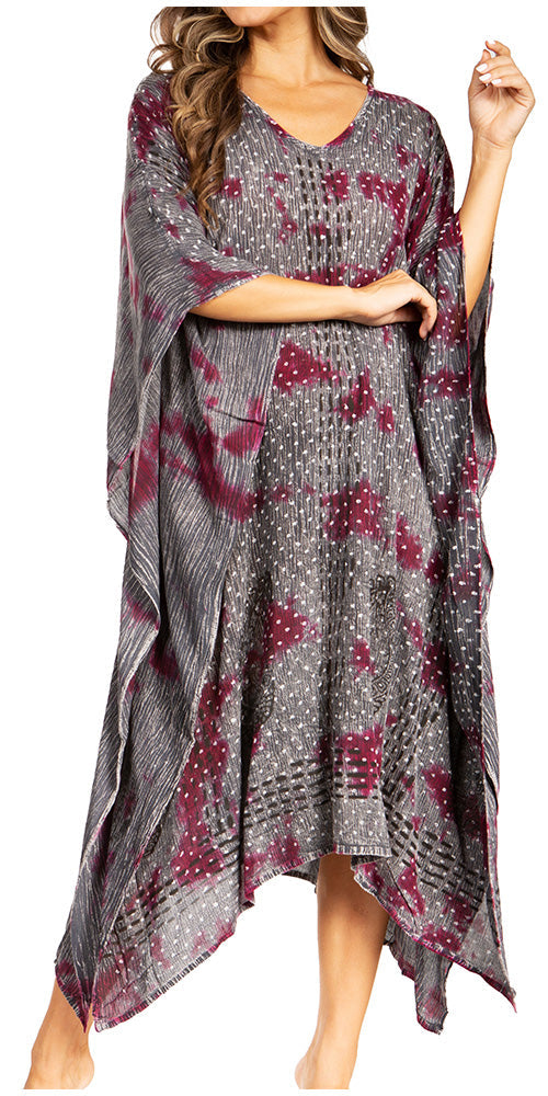 Woman wearing a patterned dress with a neutral background