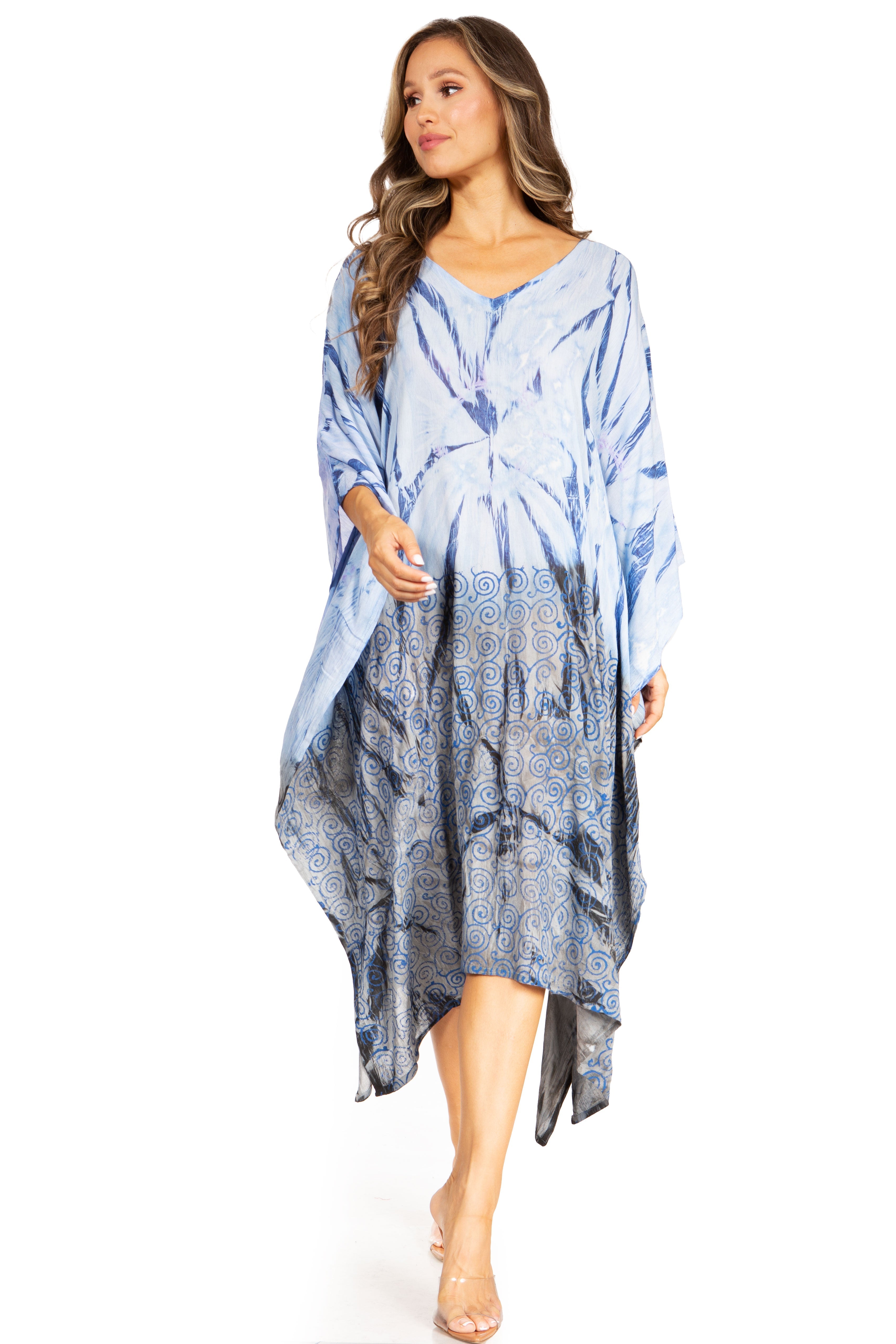 Woman wearing a blue tie-dye dress on a white background