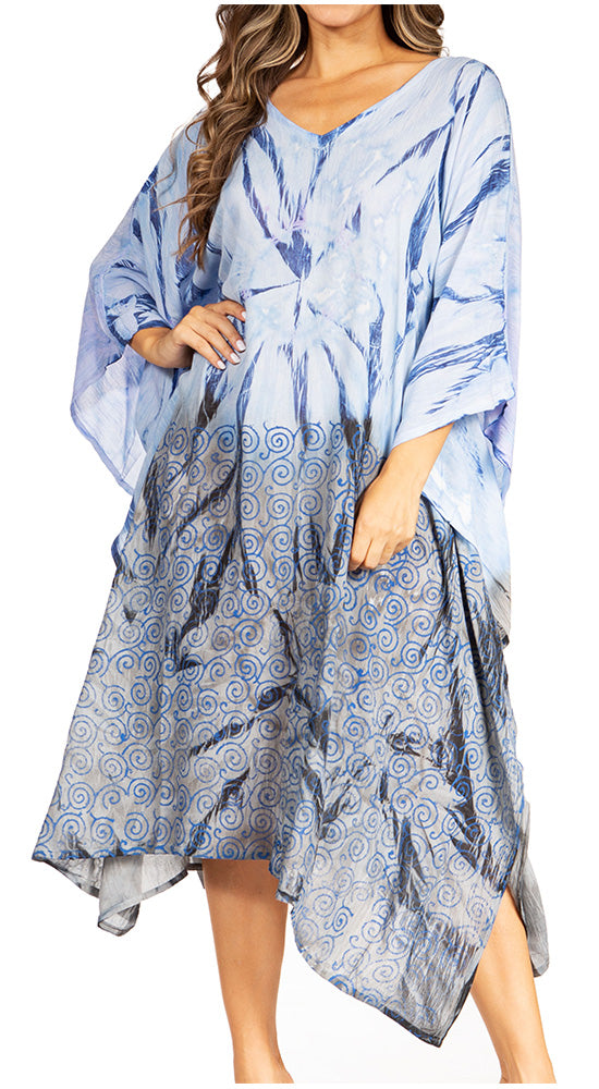 Woman wearing a blue and white patterned dress with long sleeves.