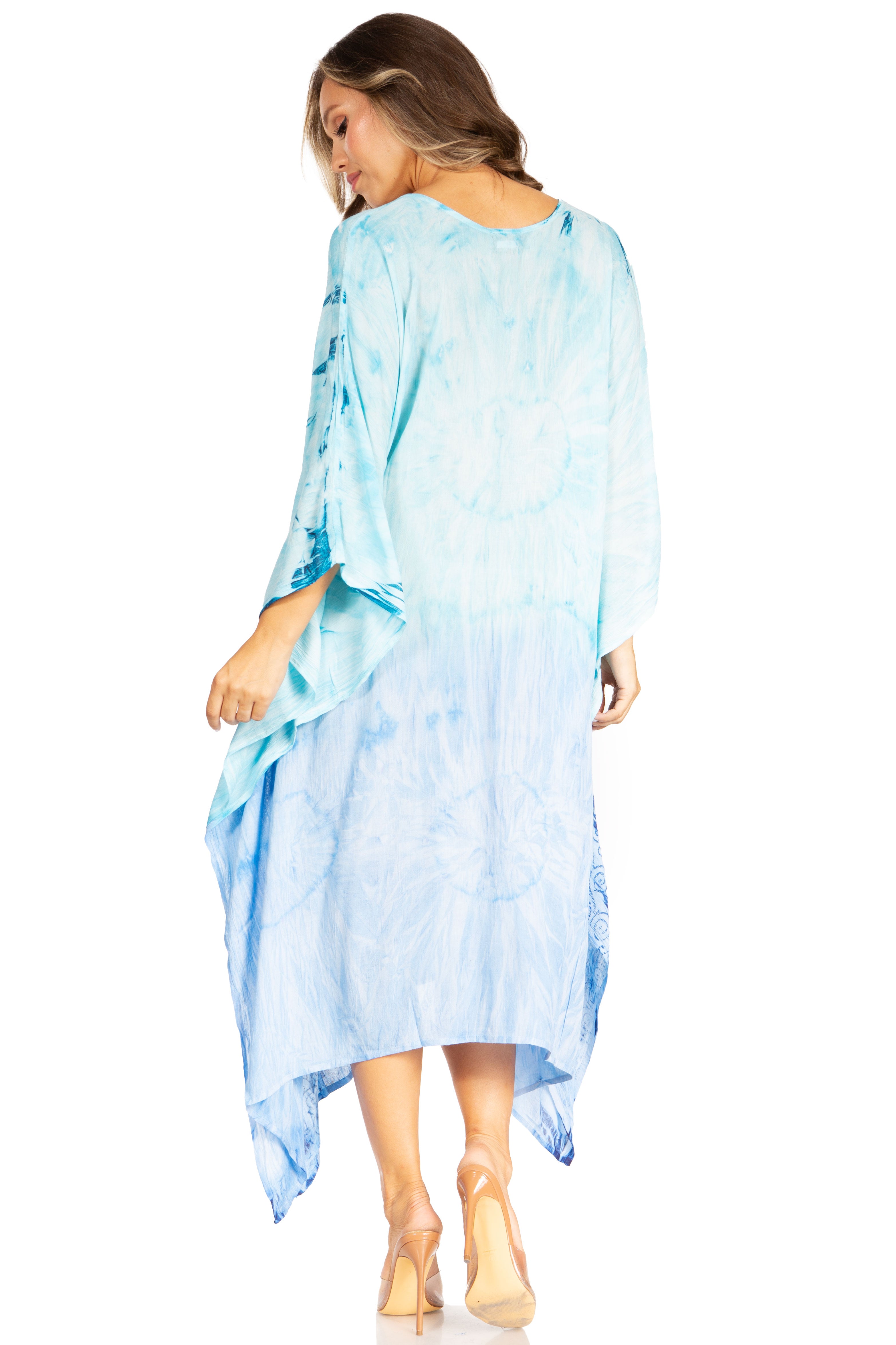 Woman wearing a light blue tie-dye dress on a white background