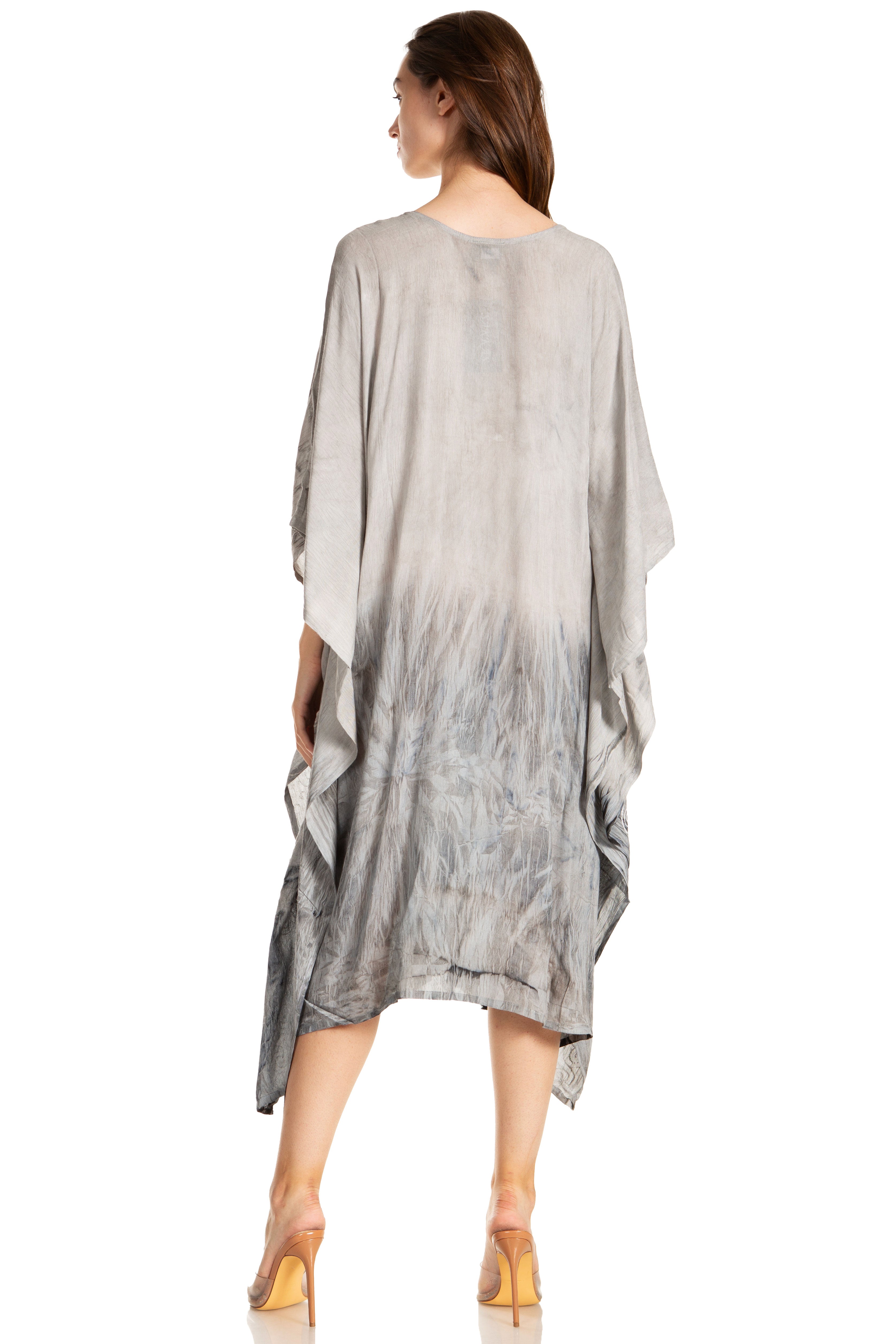 Woman wearing a gray gradient dress on a white background