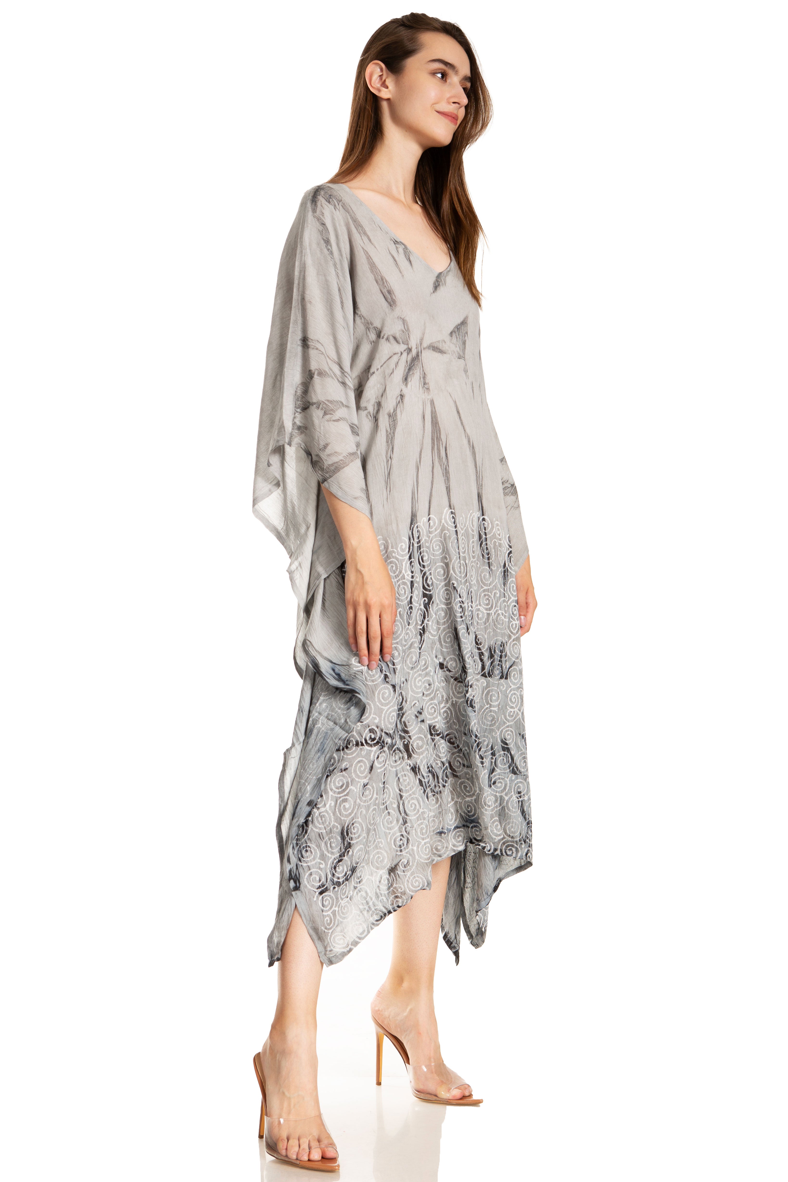 Woman wearing a gray patterned dress on a white background