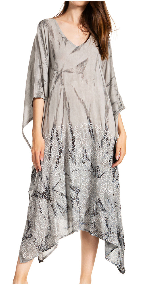 Woman wearing a gray patterned dress on a white background