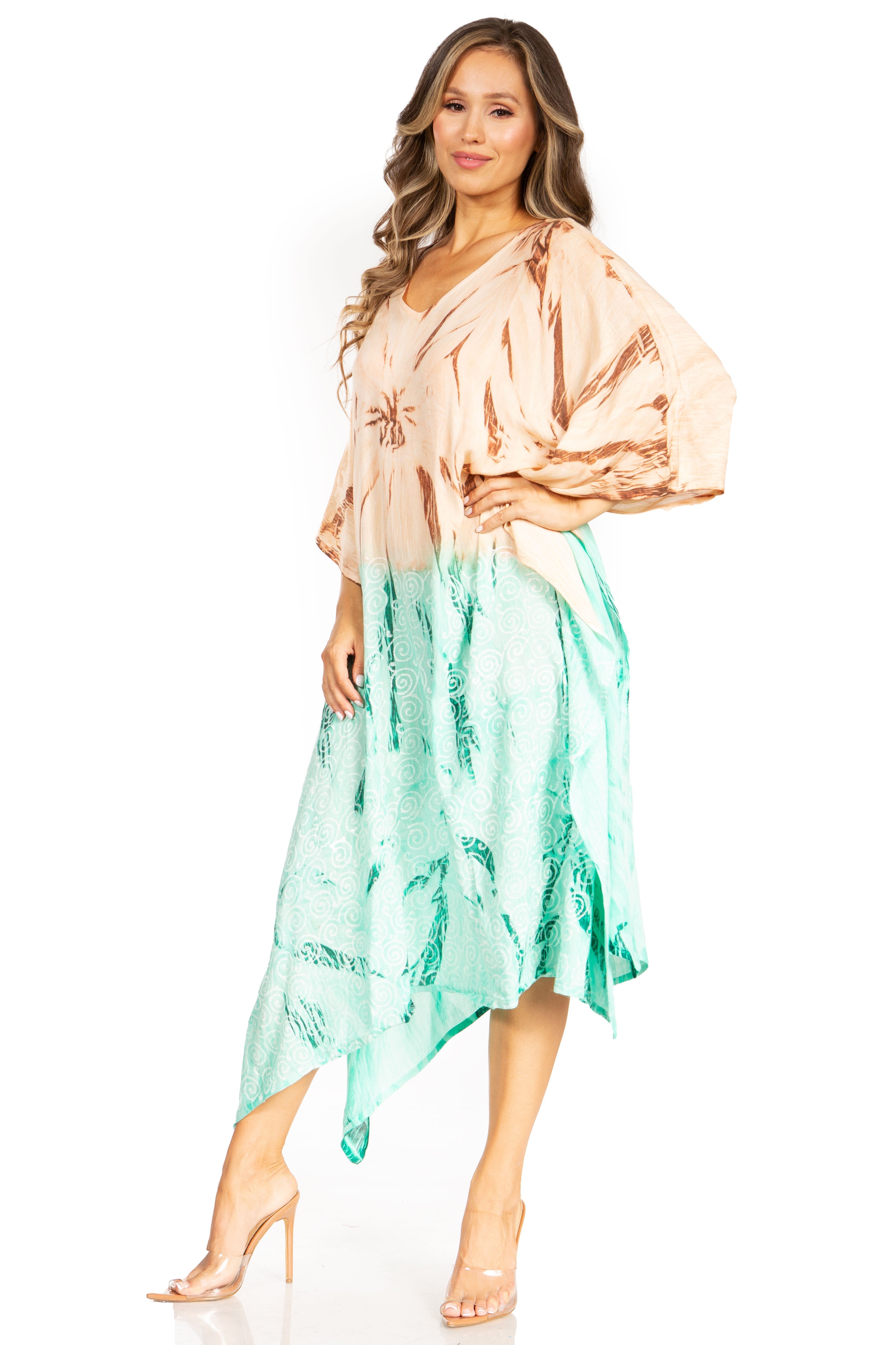 Woman wearing a two-tone dress with beige top and green bottom on a white background
