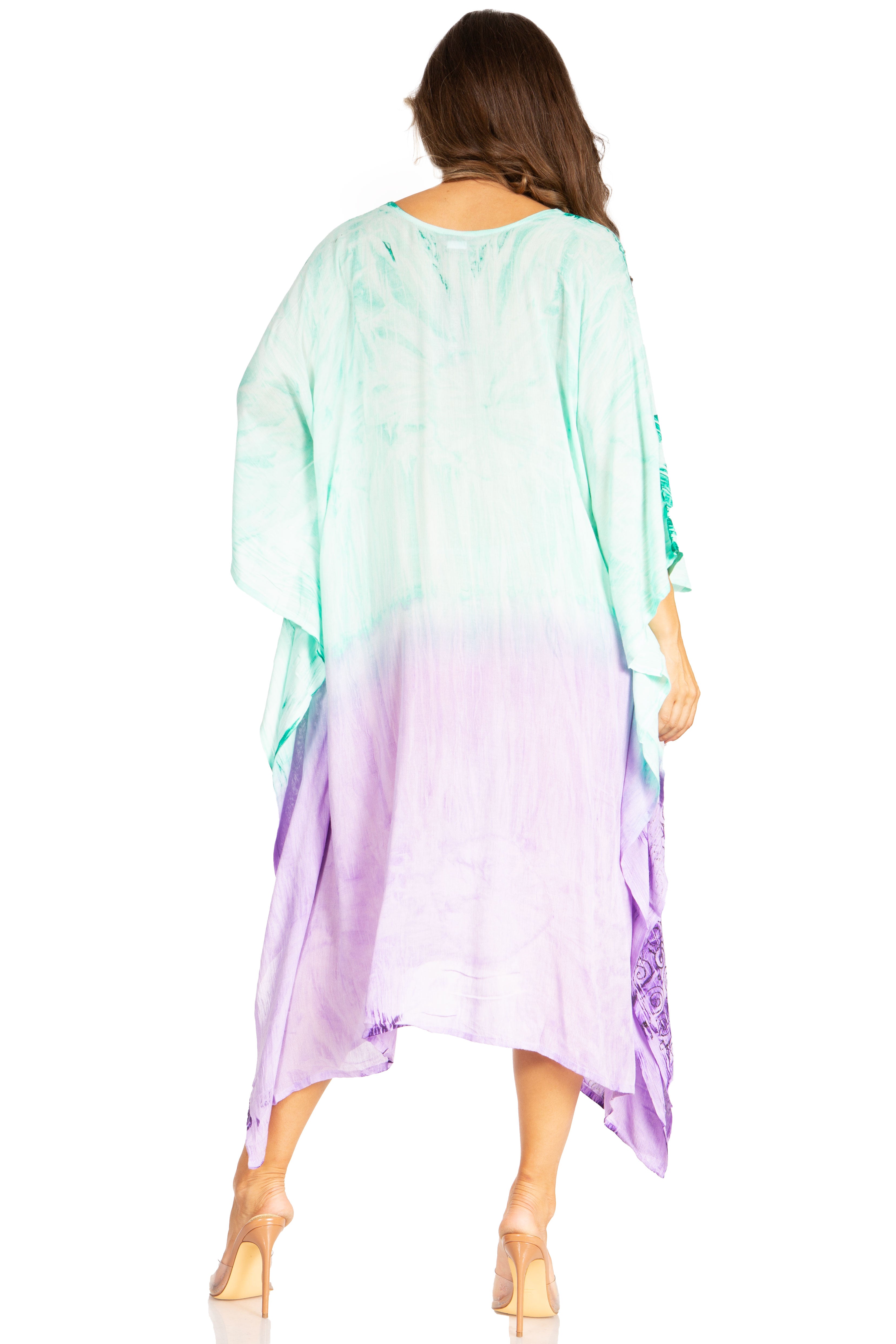 Woman wearing a colorful dress with a gradient from green to purple on a white background