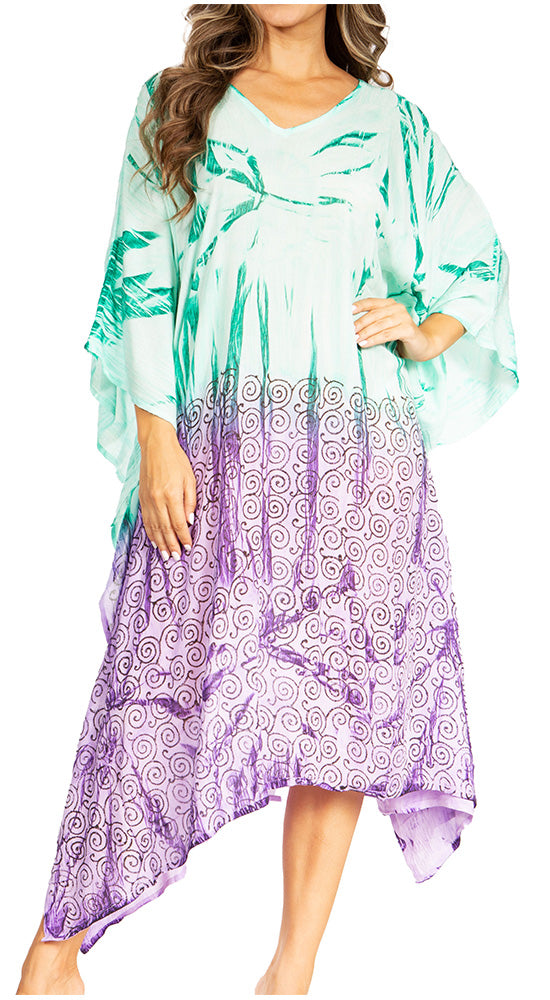 Woman wearing a colorful dress with a gradient from green to purple.