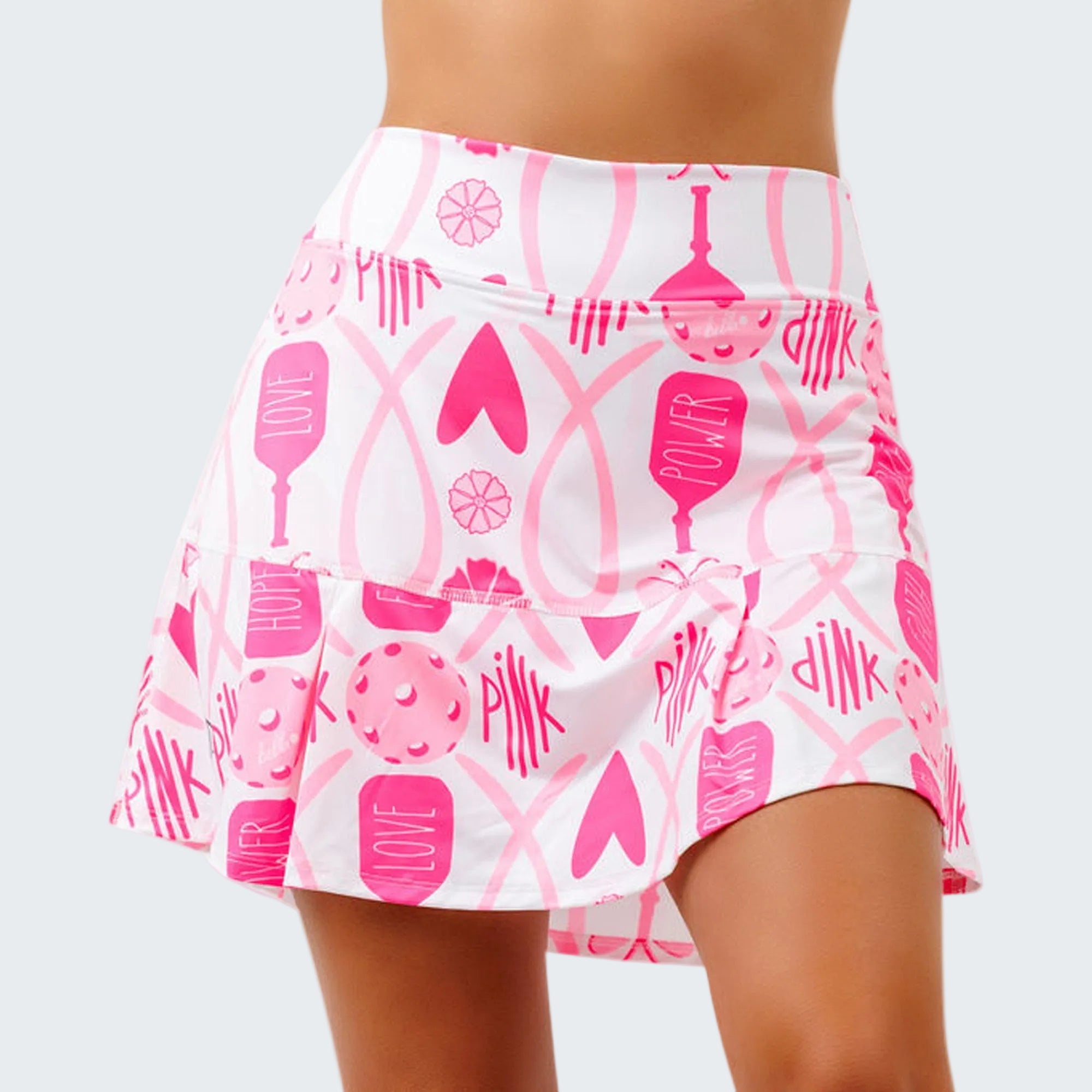 Pink and white patterned skirt on a plain background