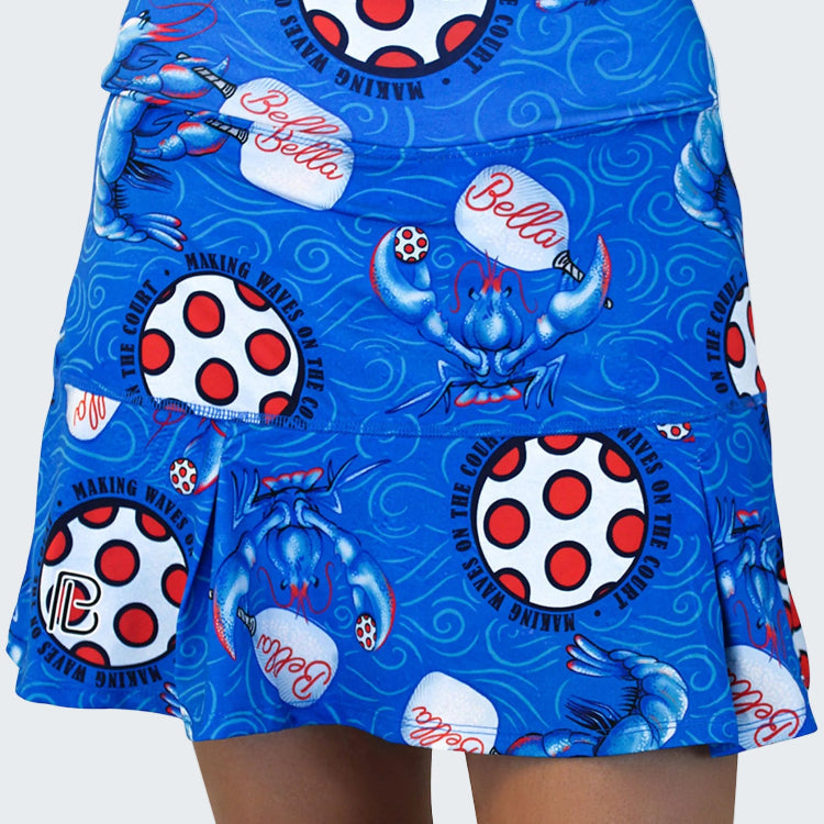 Blue skirt with crab and polka dot pattern on a white background