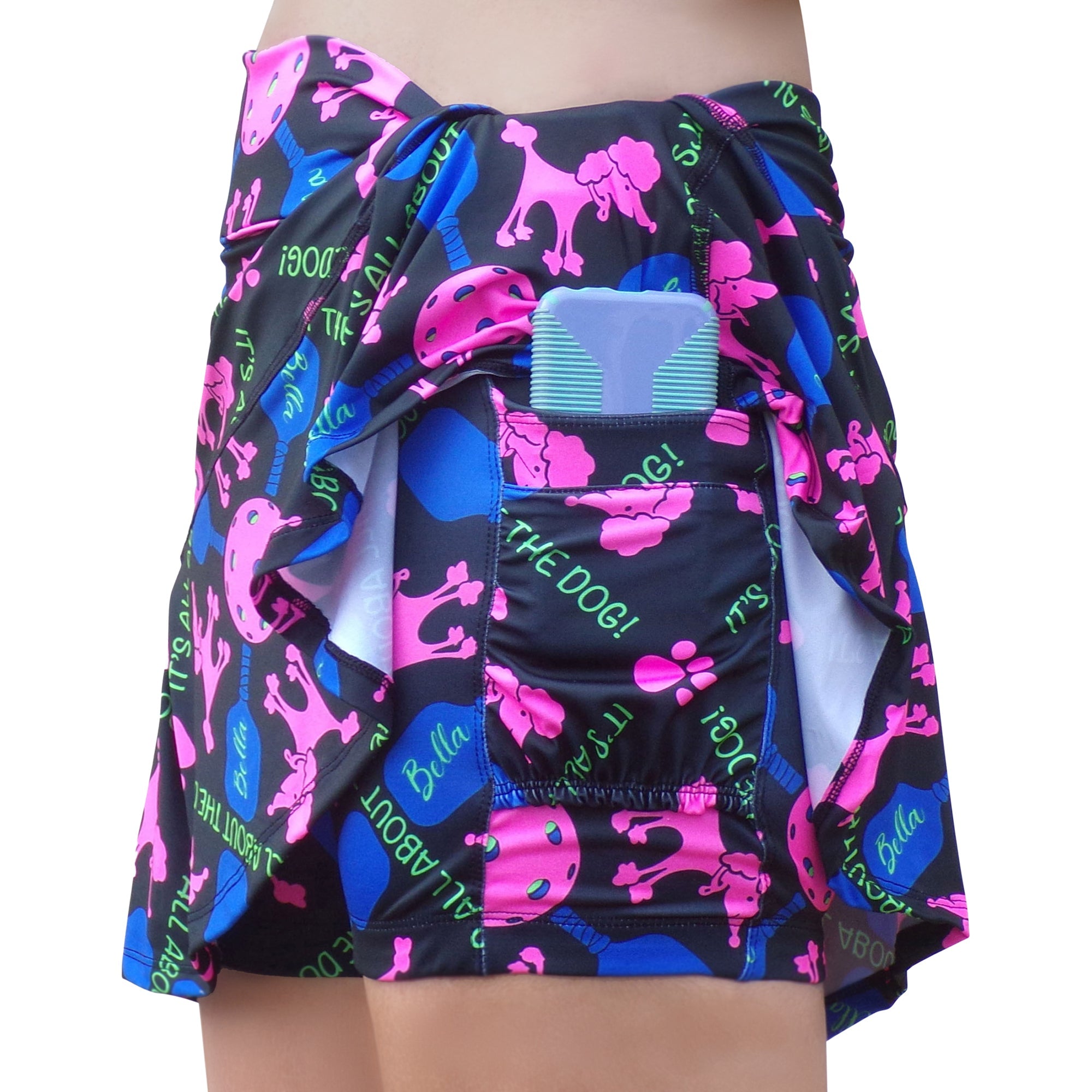 Skirt with colorful dog pattern and a bottle on a white background