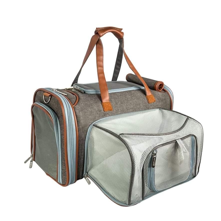 Pet carrier with brown handles on a white background