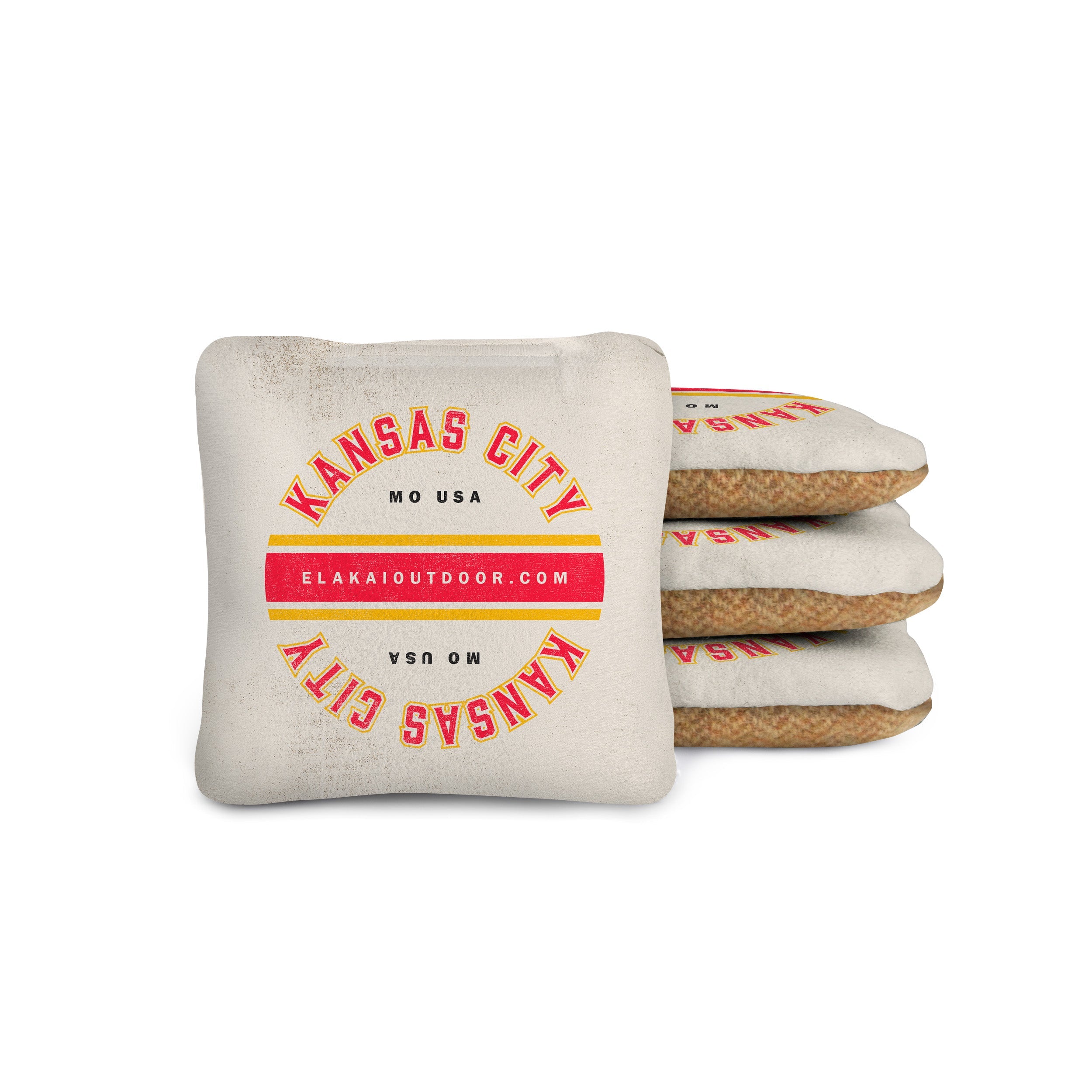 Stack of decorative pillows with 'Kansas City' text on a white background