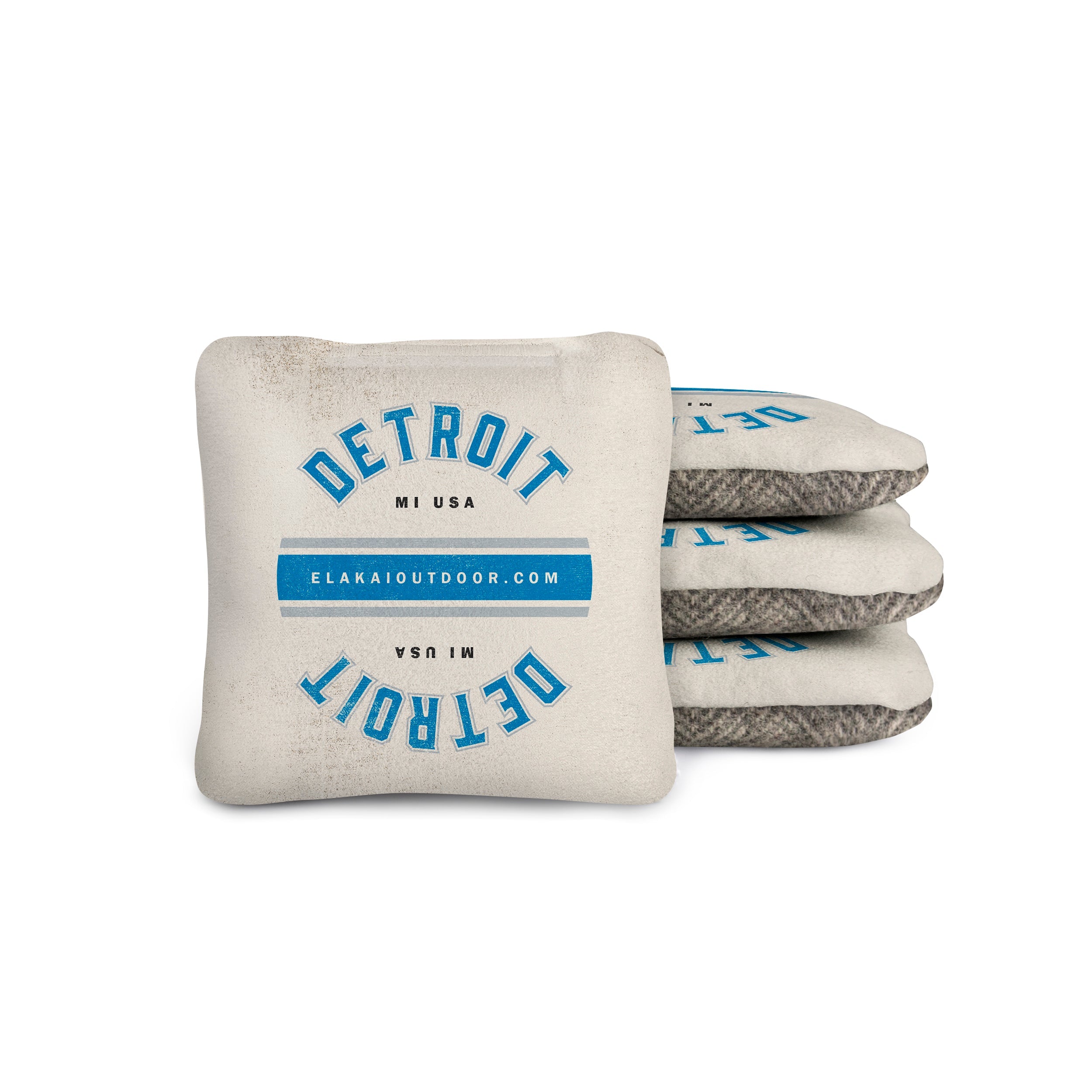 Stack of cornhole bags with 'Detroit MI USA' text on a white background
