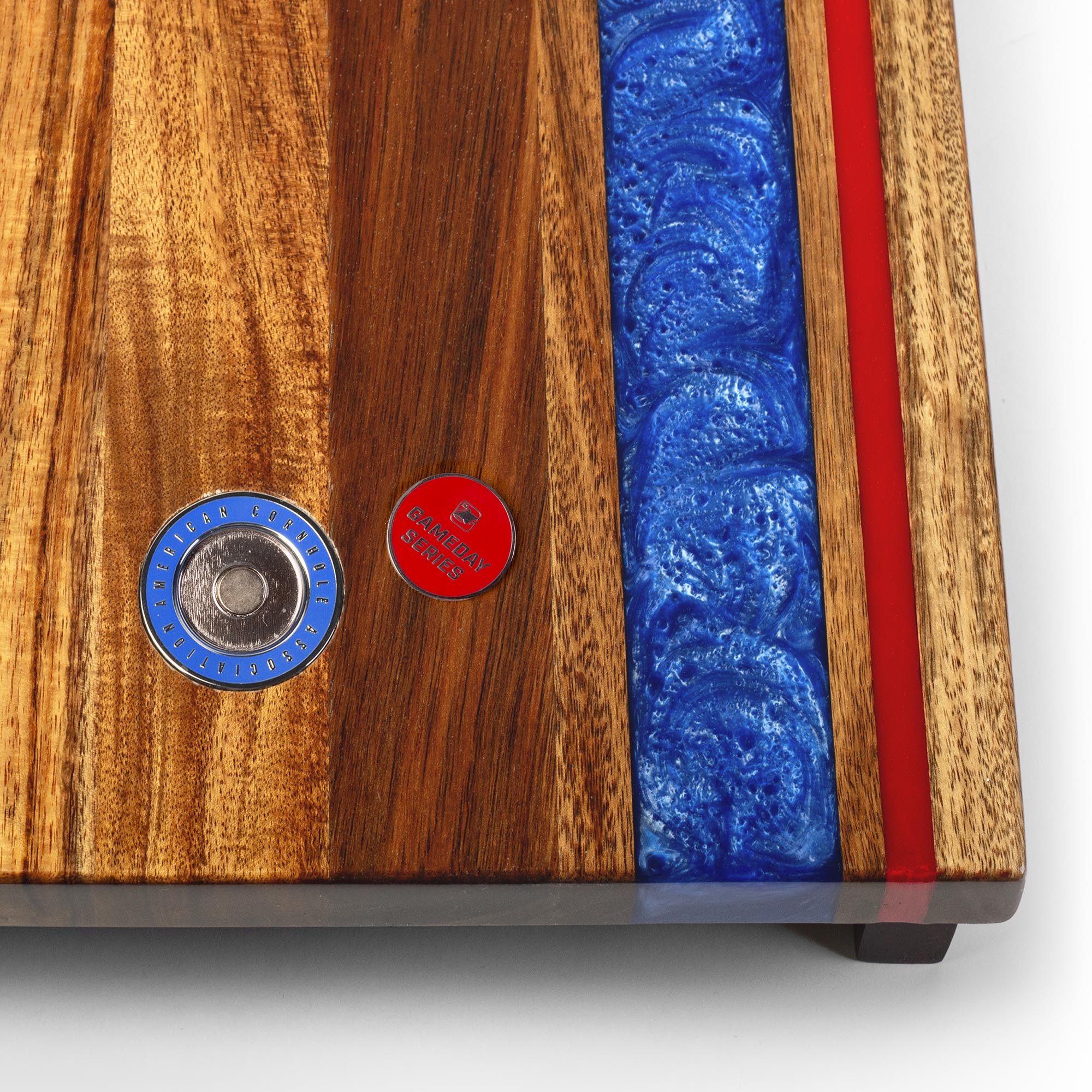 Wooden product with blue resin inlay and red strip on a white background