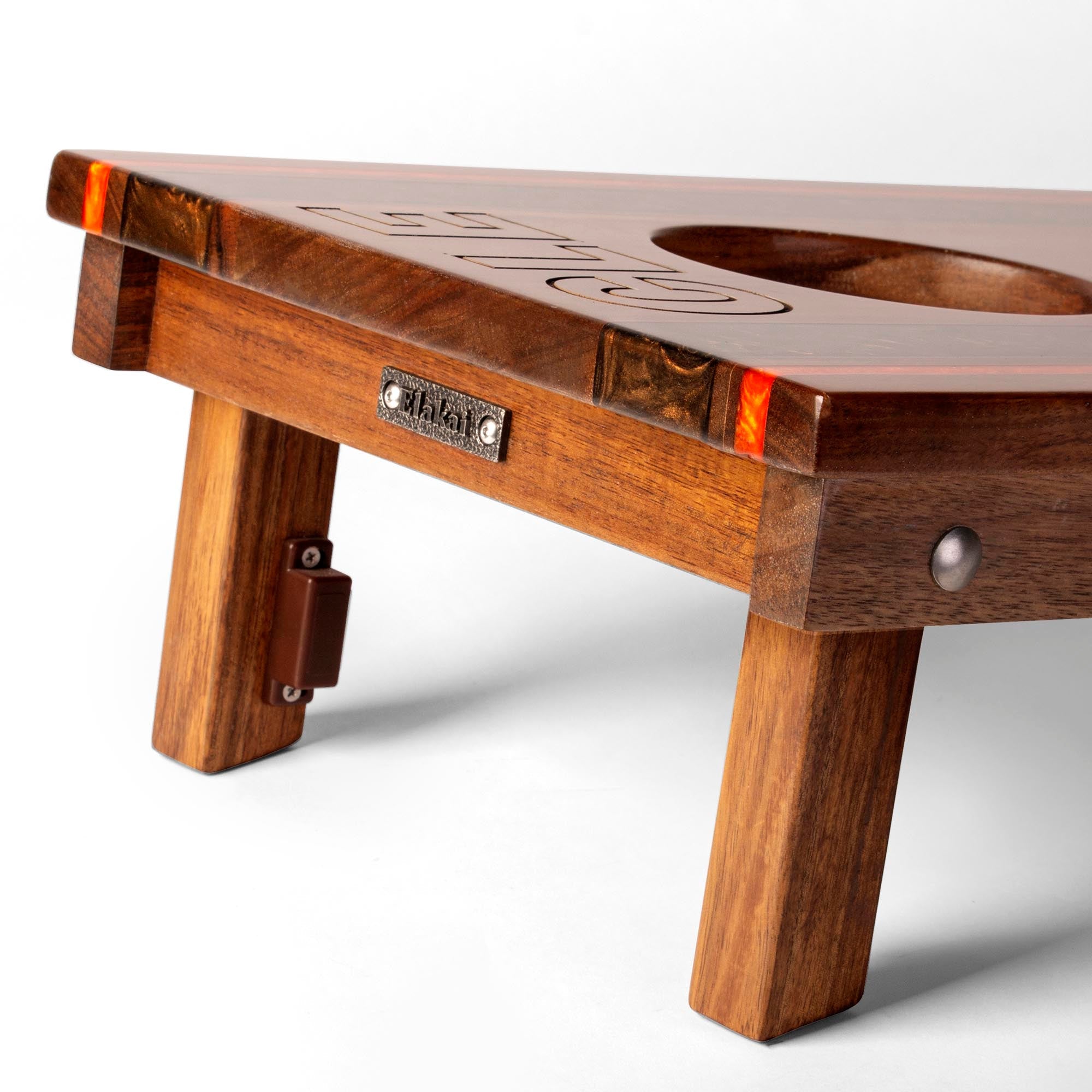 Wooden beer pong table with branding on a white background