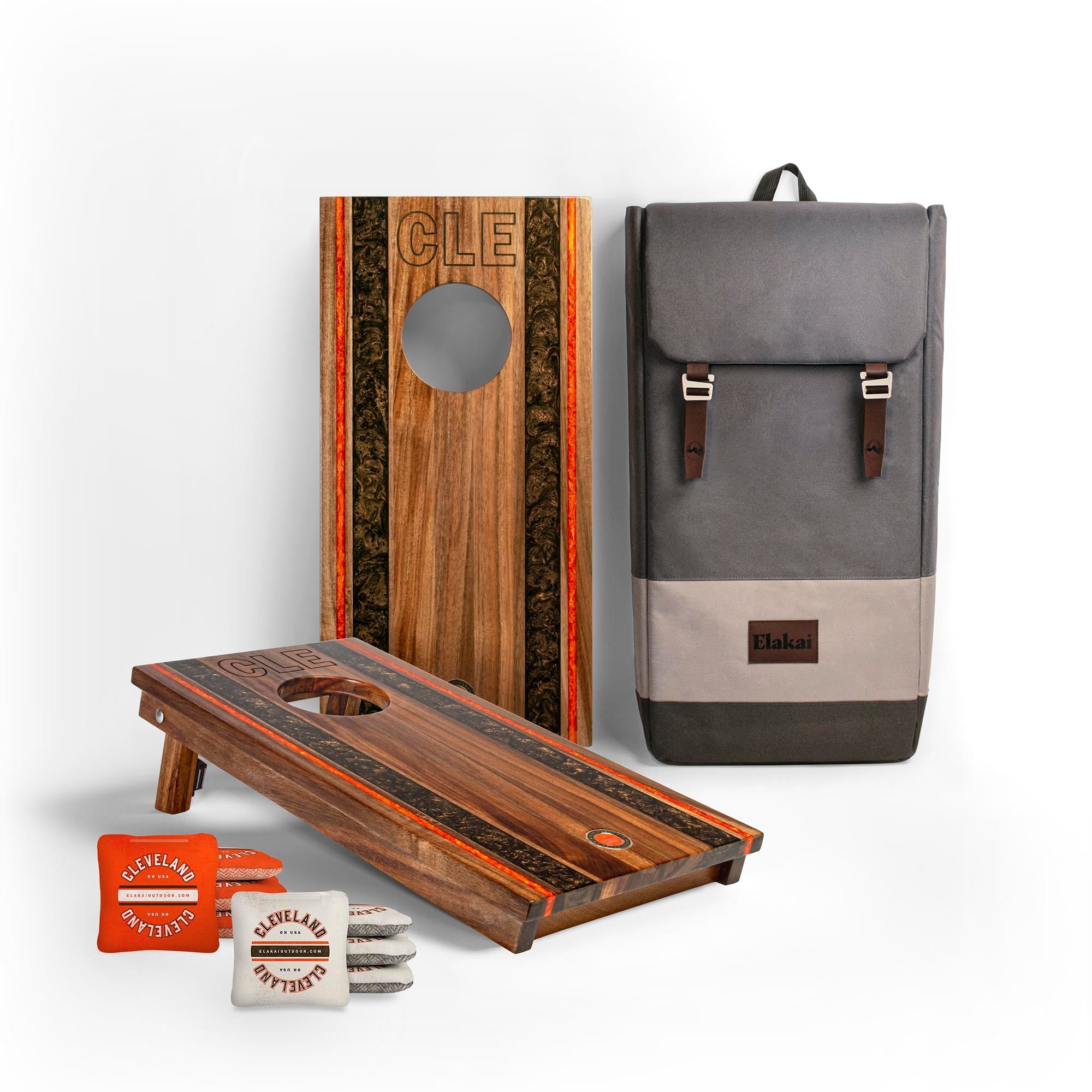 Cornhole boards with 'CLE' branding, a backpack, and branded items on a white background