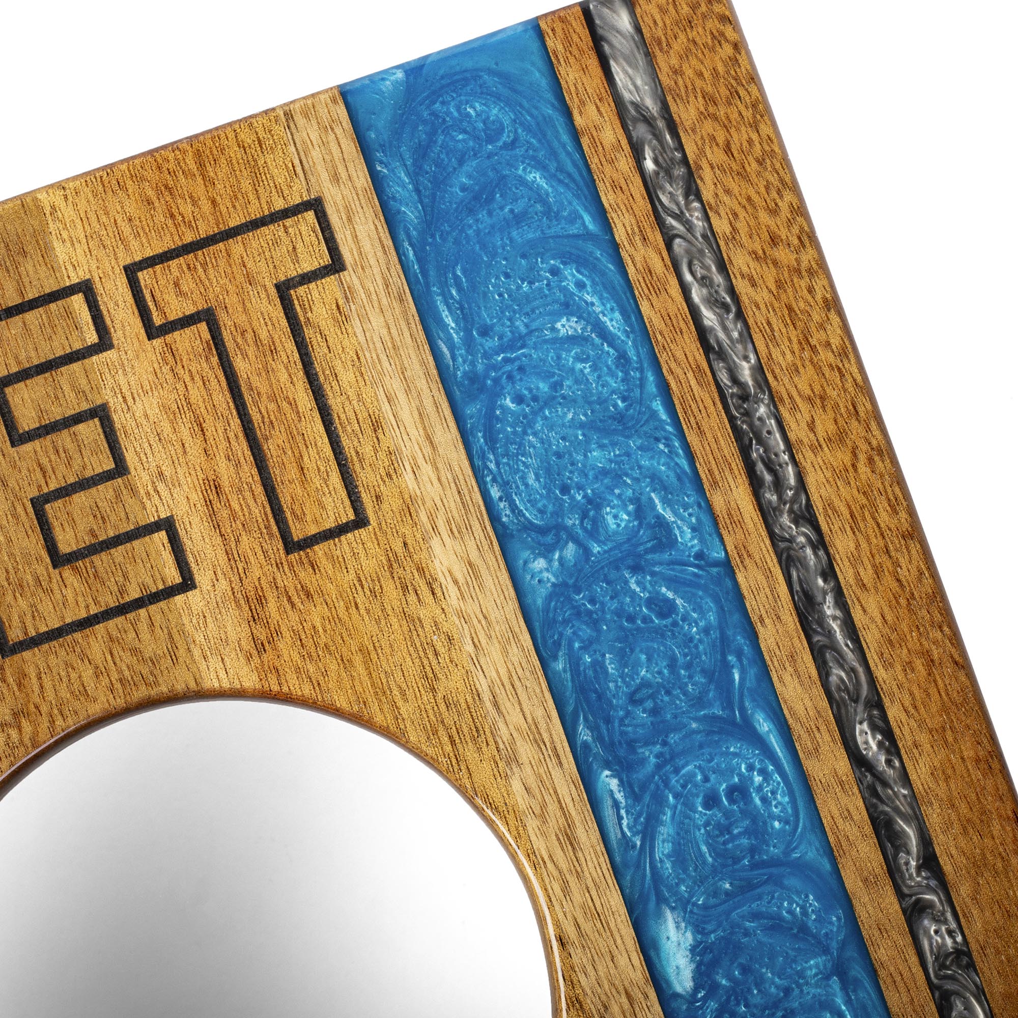 Wooden sign with blue and silver design on a white background