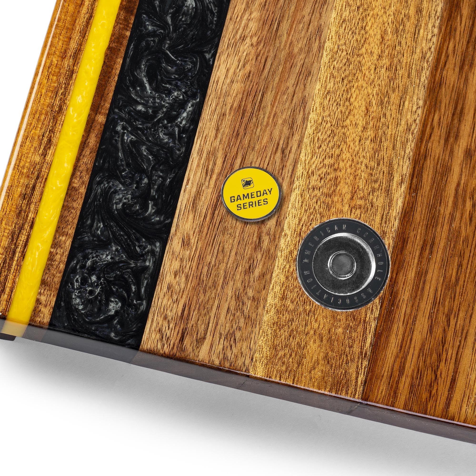 Close-up of a wooden product with a yellow label and black interior.