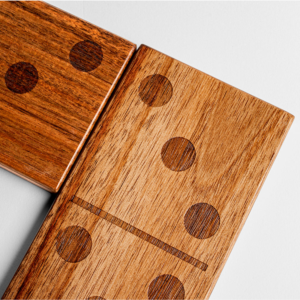 Close-up of wooden dominoes with a light gray background