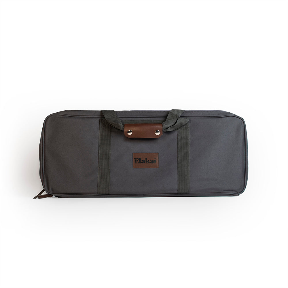 Gray bag with brown leather accents and 'Elaka' branding on a white background