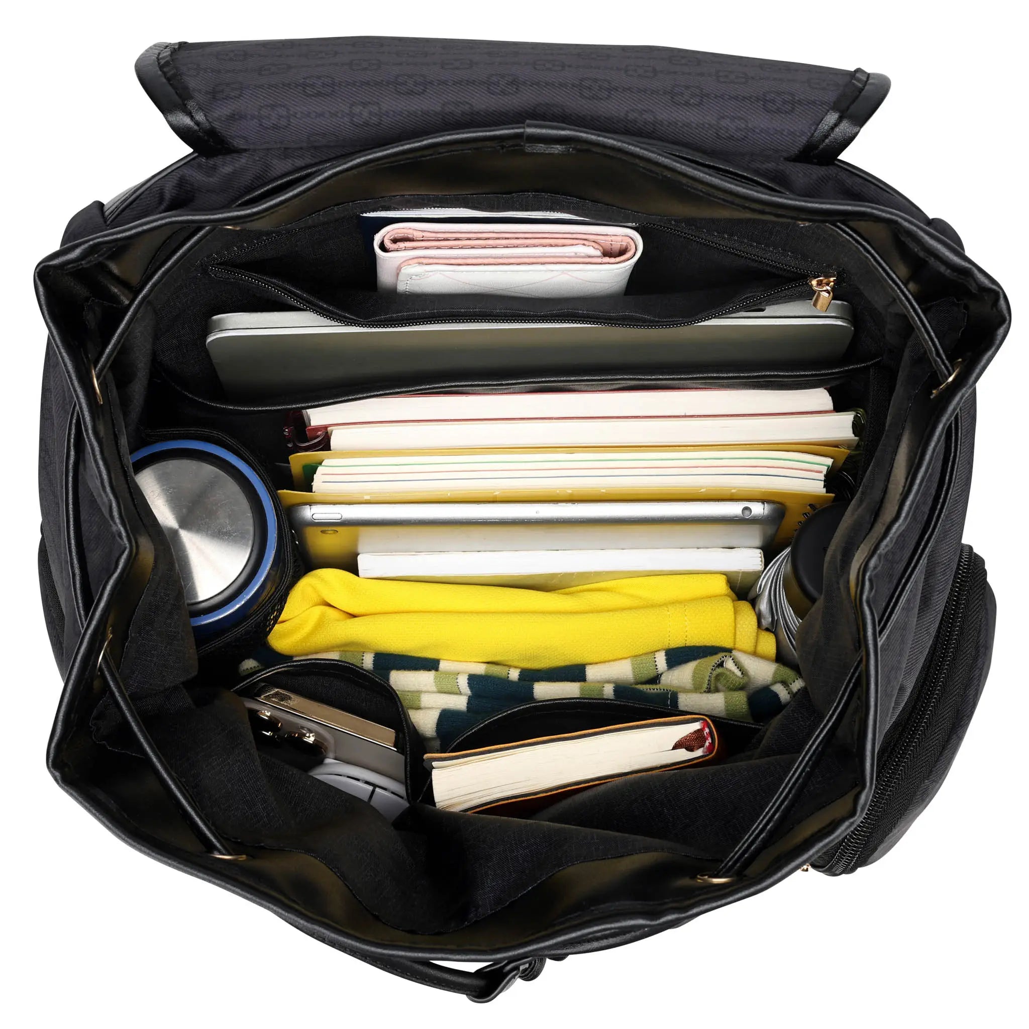 Black bag with various items including clothes and a bowl on a white background