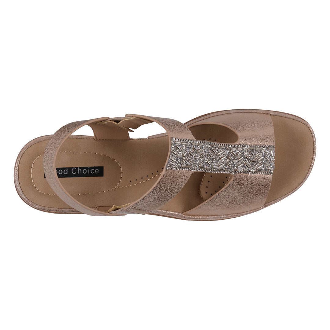 Brown sandal with a decorative strap on a white background