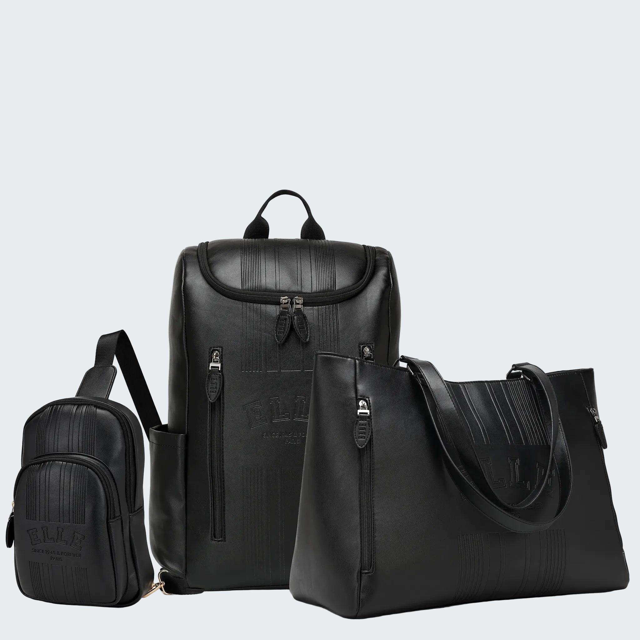 Set of black leather bags including a backpack, crossbody bag, and smaller pouch on a white background.