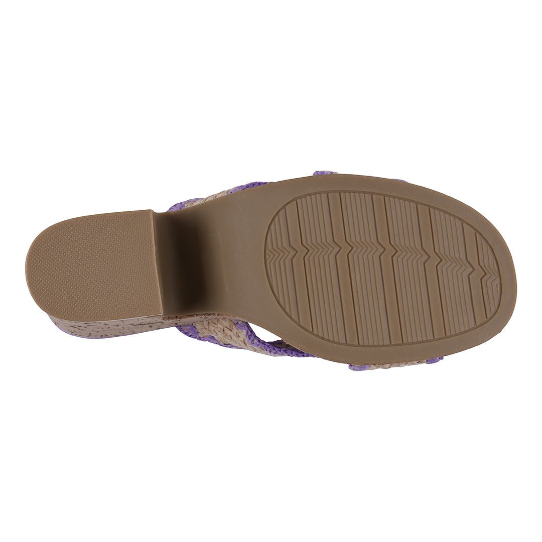 Brown sandal sole with textured surface on a white background
