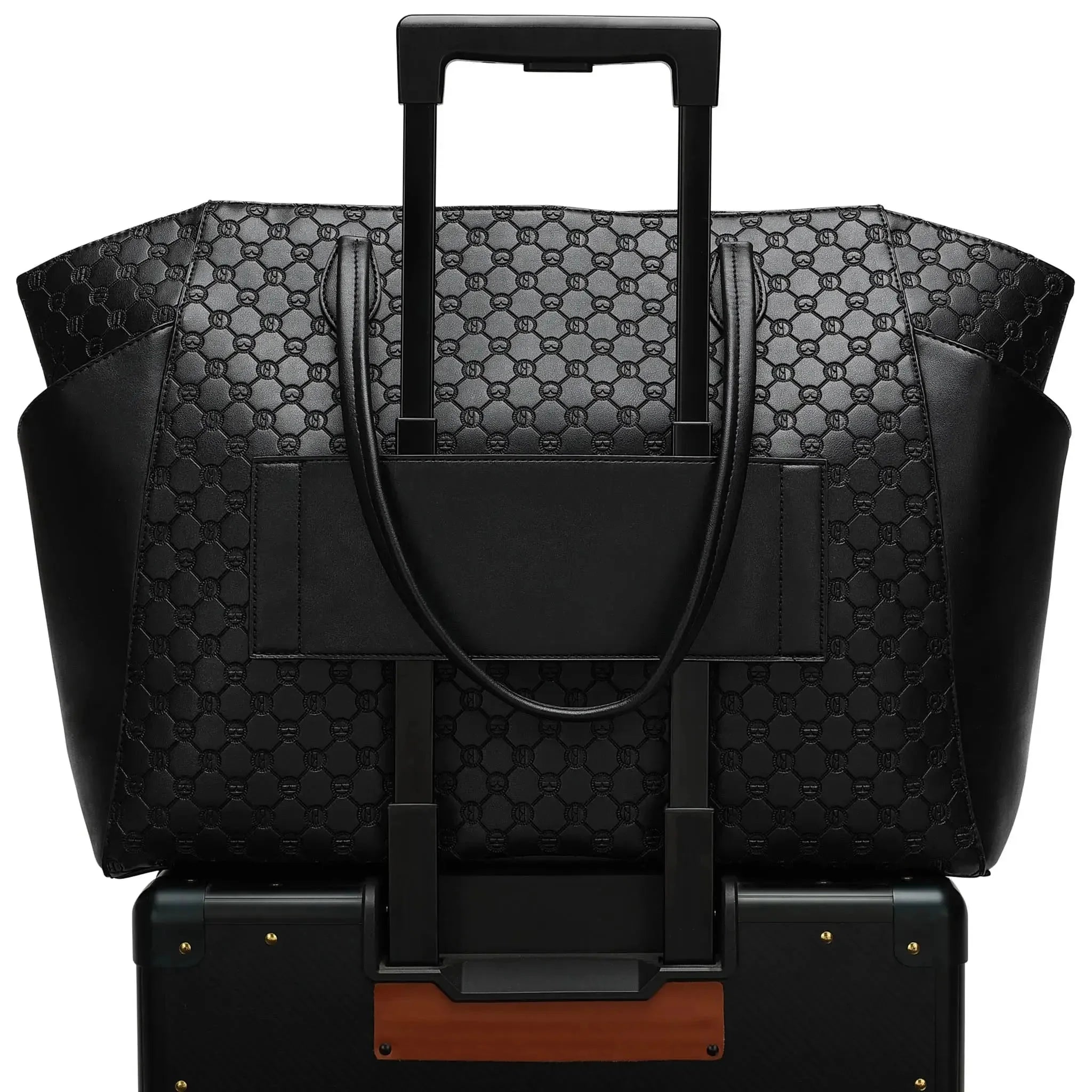 Black patterned suitcase with handle and shoulder strap on a white background