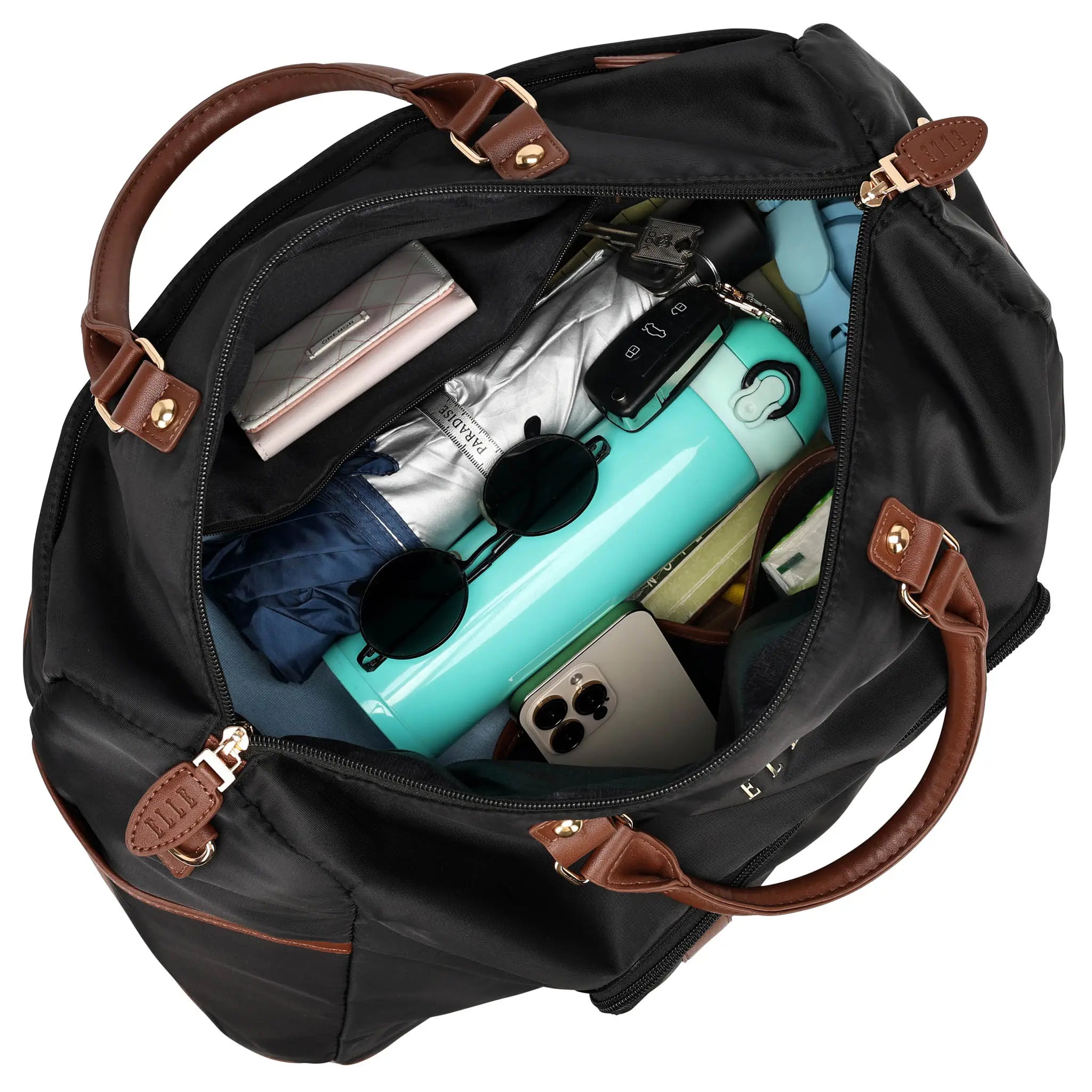 Black duffel bag with brown handles and trim, filled with travel items on a white background.