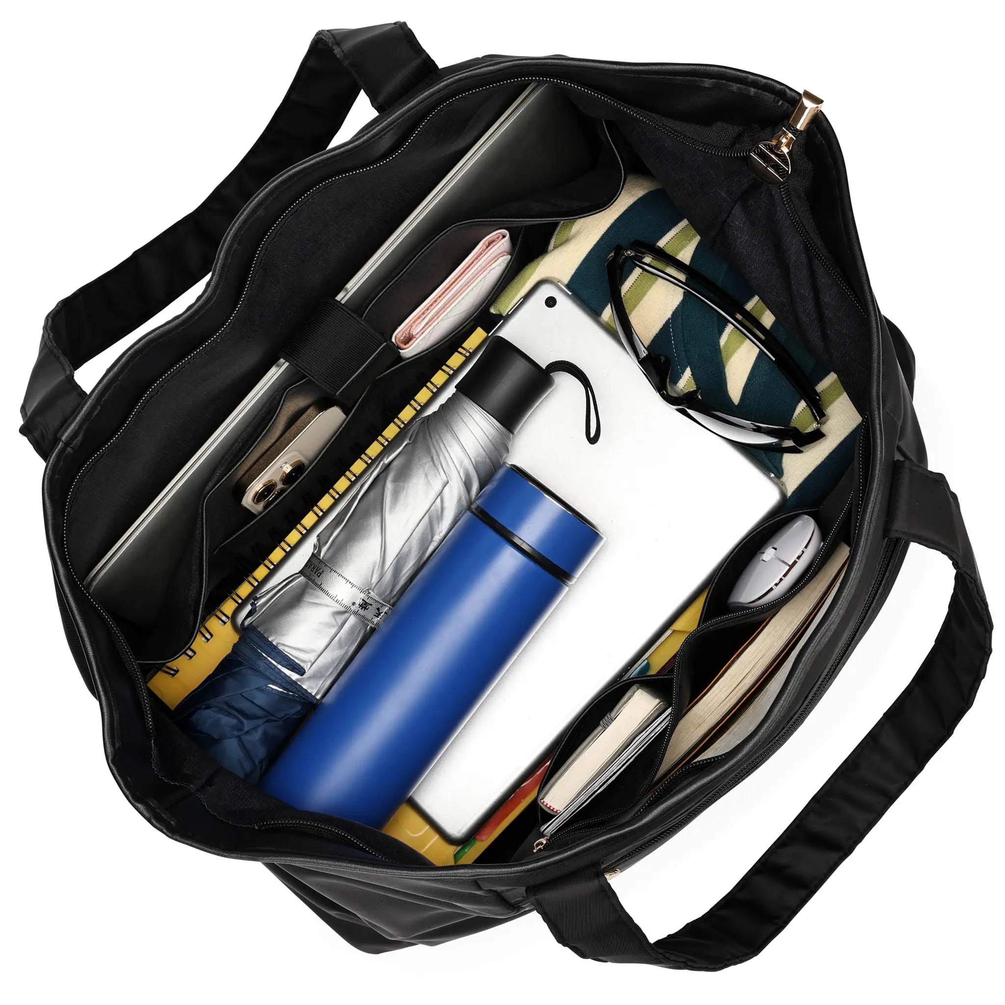 Black bag with various items including a blue water bottle, white pen, and other stationery on a white background