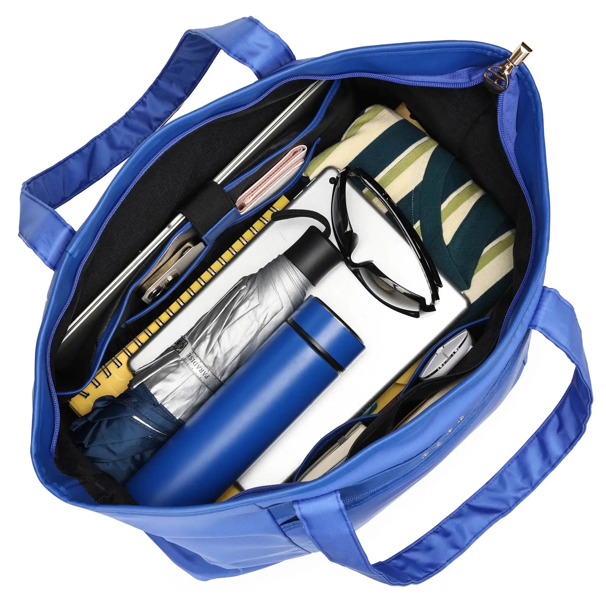 Blue tote bag with various items including a water bottle, notebook, and sunglasses.