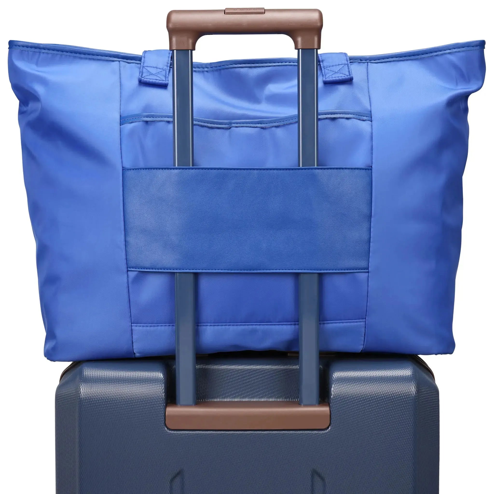 Blue suitcase with a blue bag on top on a white background