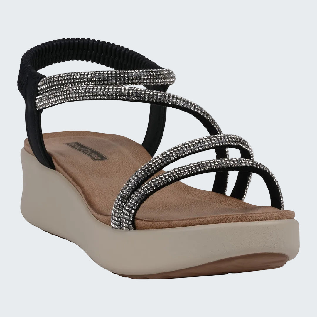 Black and silver sandal with a beige sole on a white background