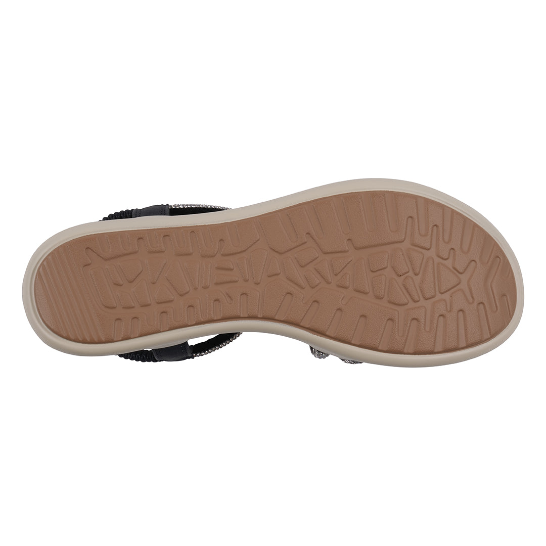 Close-up of a shoe sole with a textured pattern on a white background
