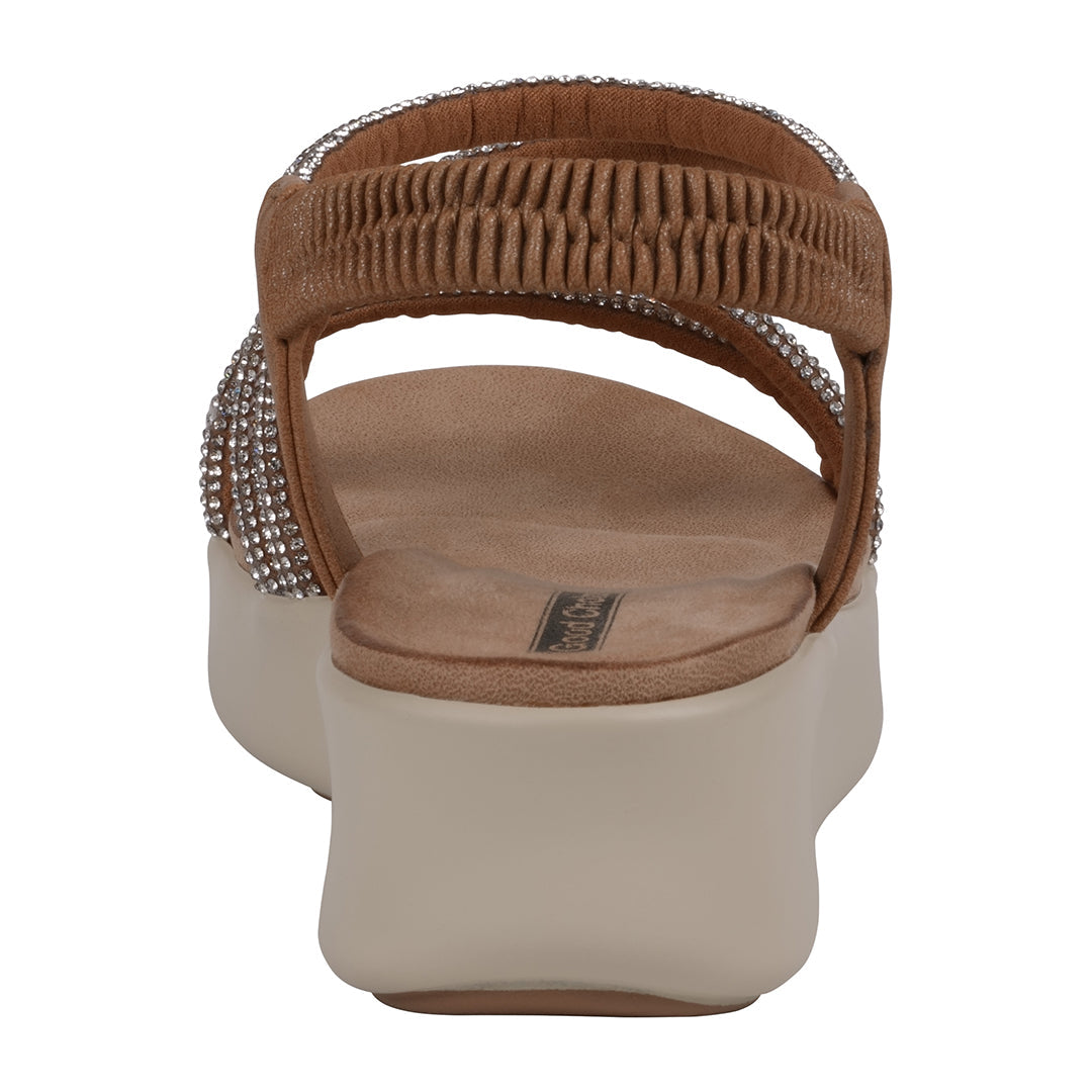 Brown sandal with embellished straps on a white background