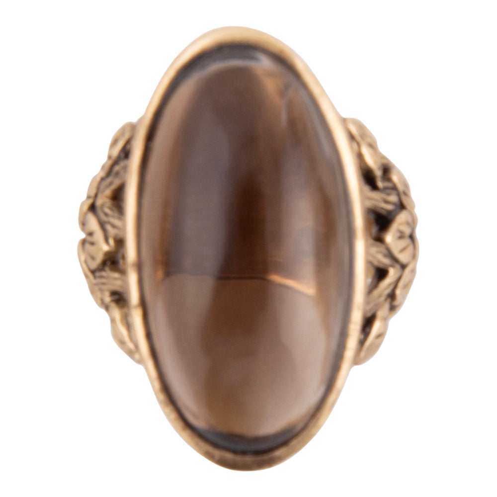 Bronze ring with a brown stone on a white background